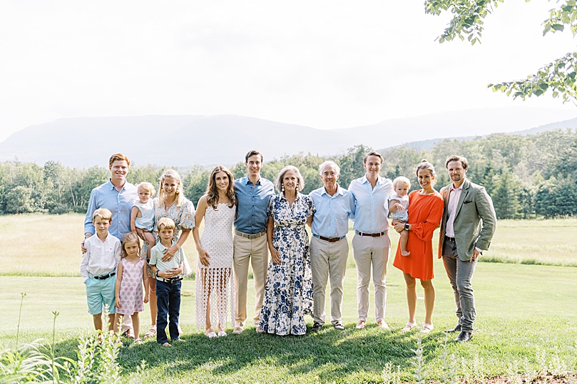 large family in field for rehearsal dinner photography coverage