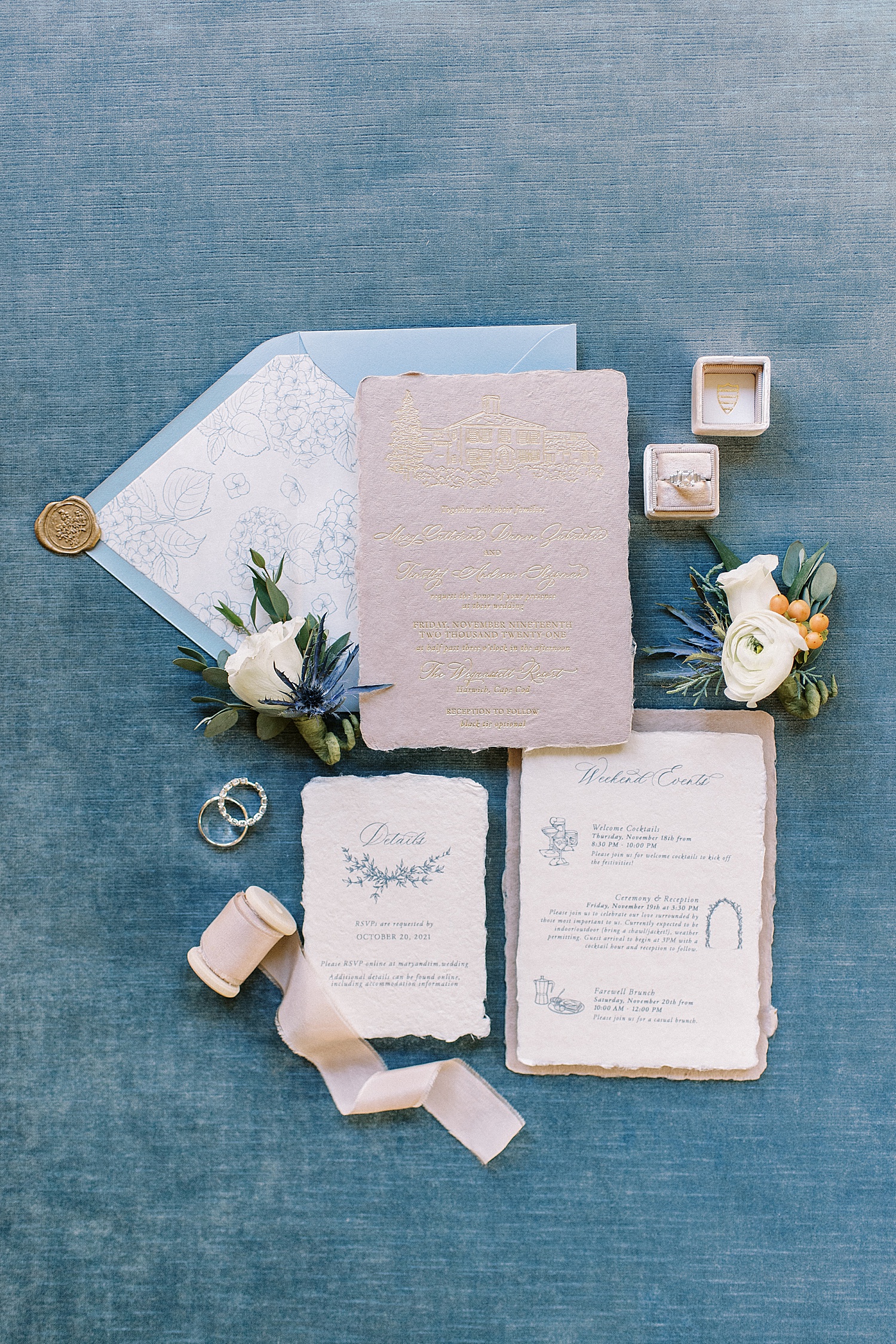 Beautiful wedding invitation suite on blue linen background by New York Photographer Lynne Reznick