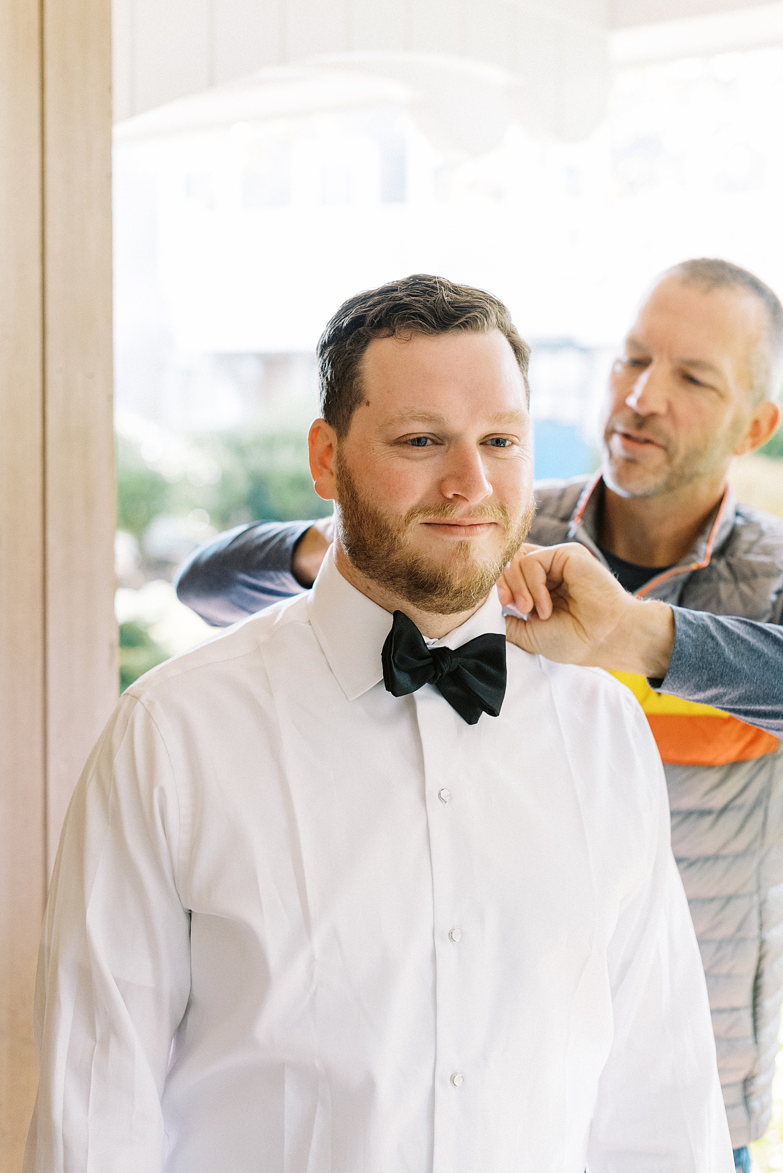 Groom getting ready at Wequassett Resort for his big day