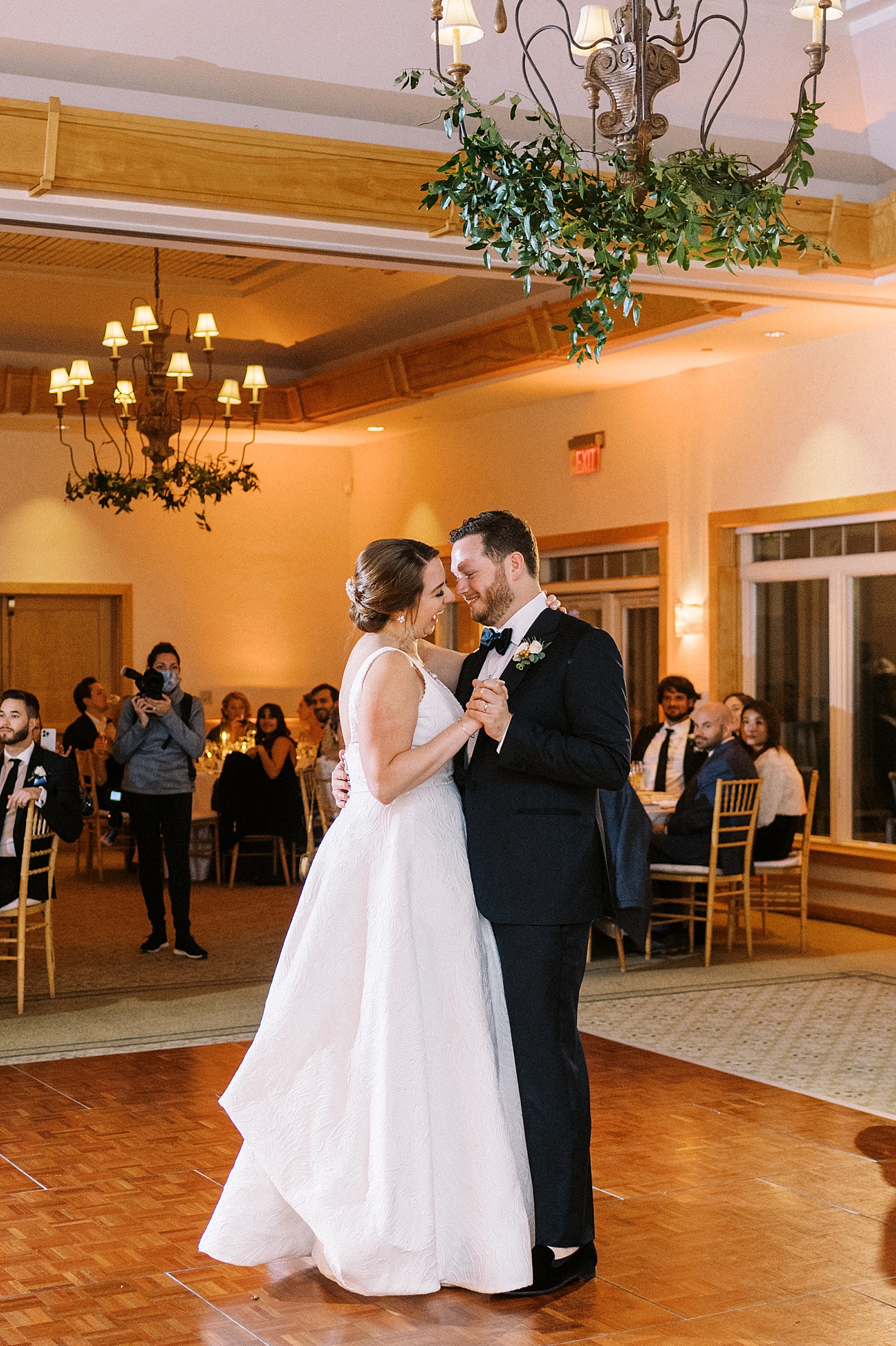 newlyweds sharing their first dance in ballroom in cape cod
