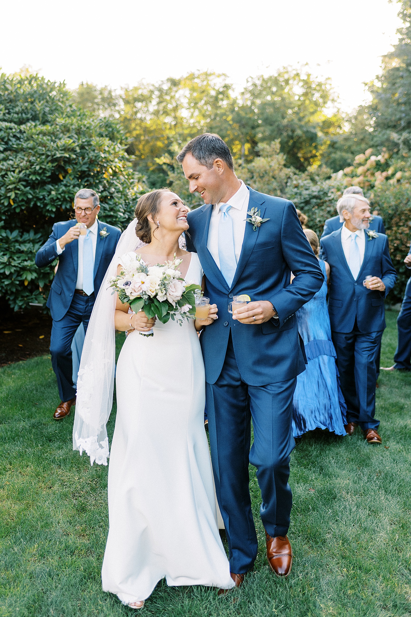 Newlyweds smiling at each other before reception by Cape Cod wedding photographer Lynne Reznick