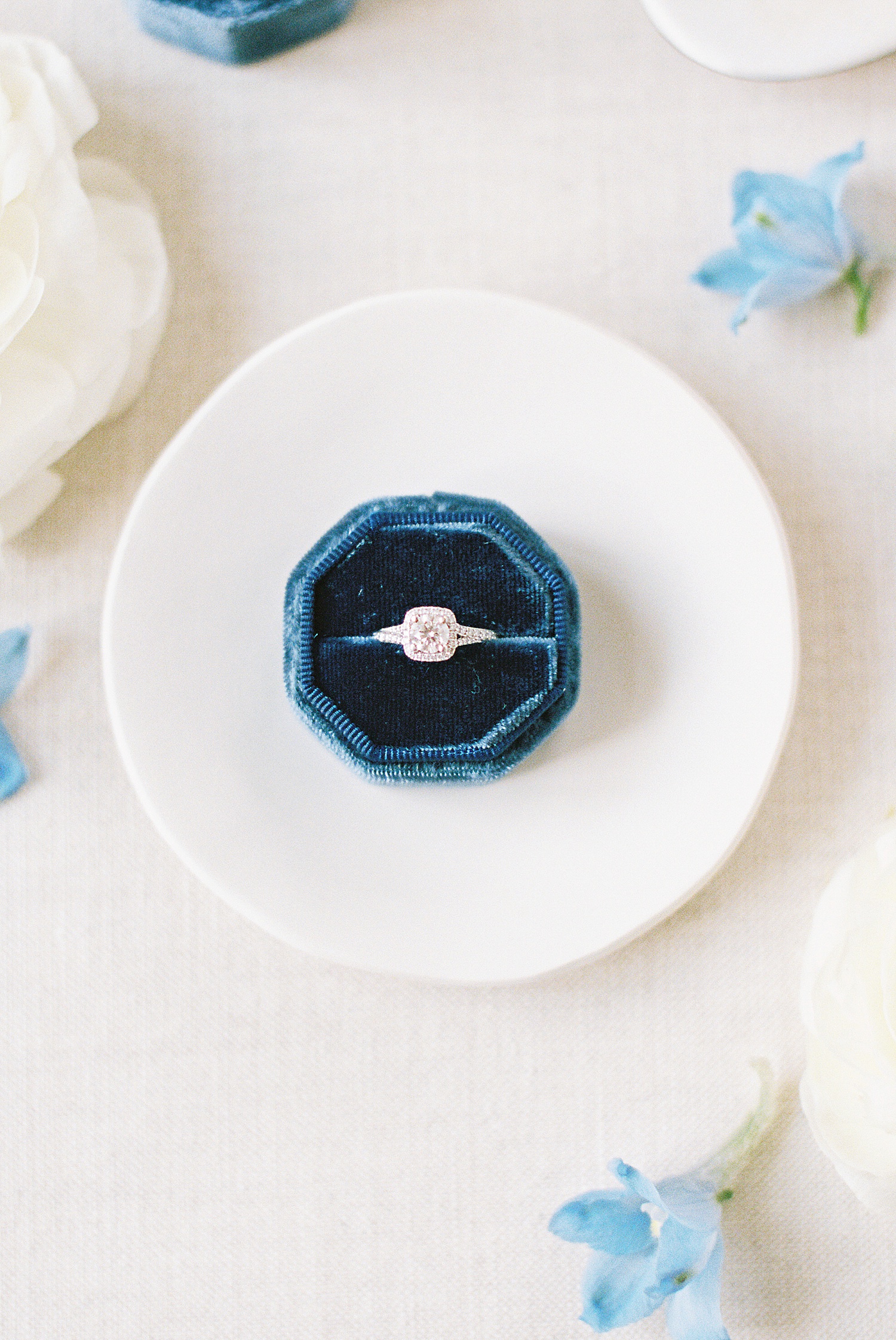 Ring in a blue velvet box for Fourth of July day by New York wedding photographer