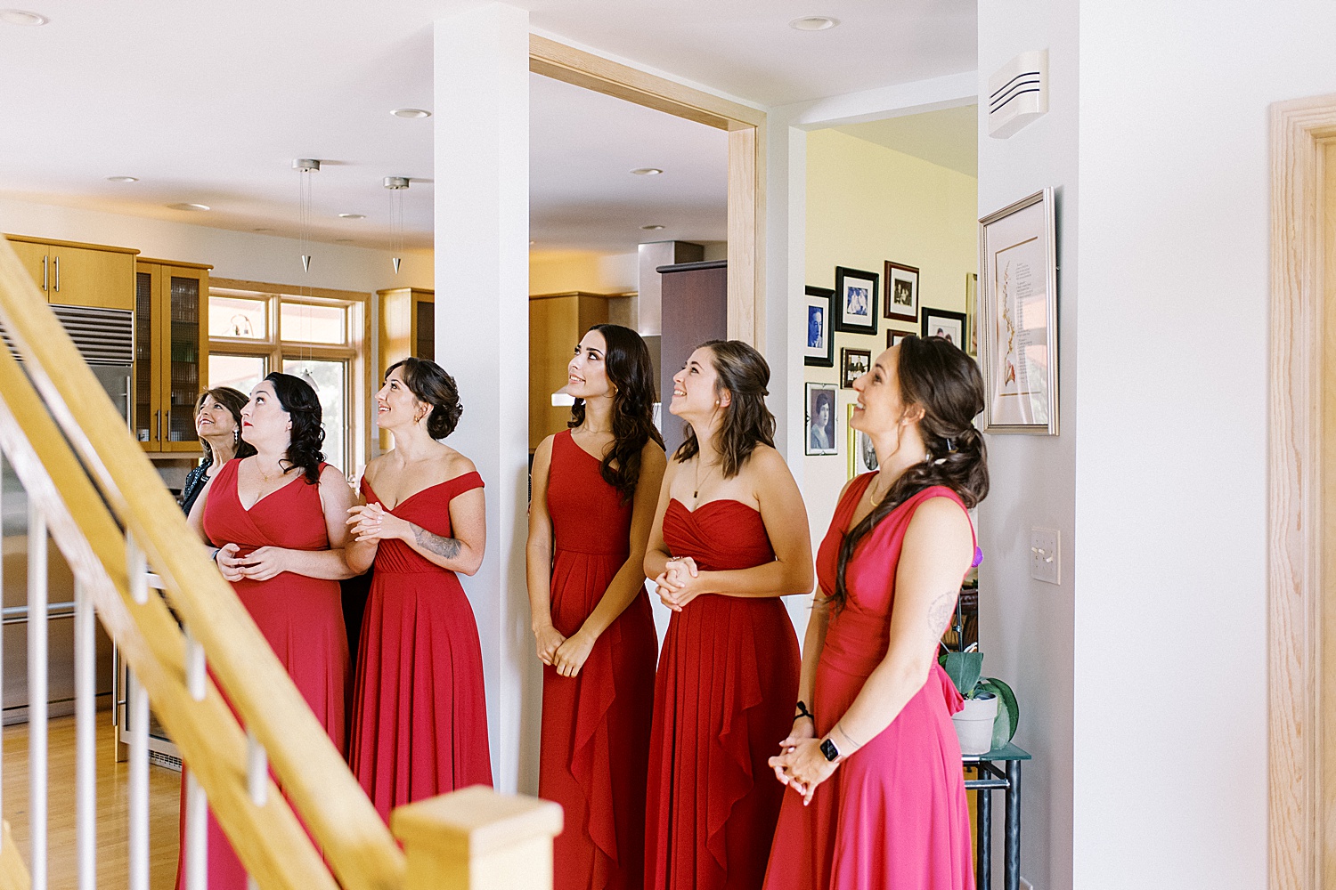 Bridesmaids watching bride walk down stairs at for Valley View Farm wedding