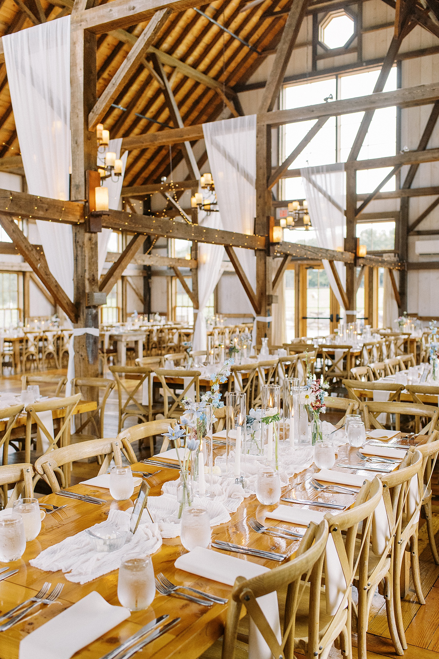 Table settings at barn style reception at for Valley View Farm wedding