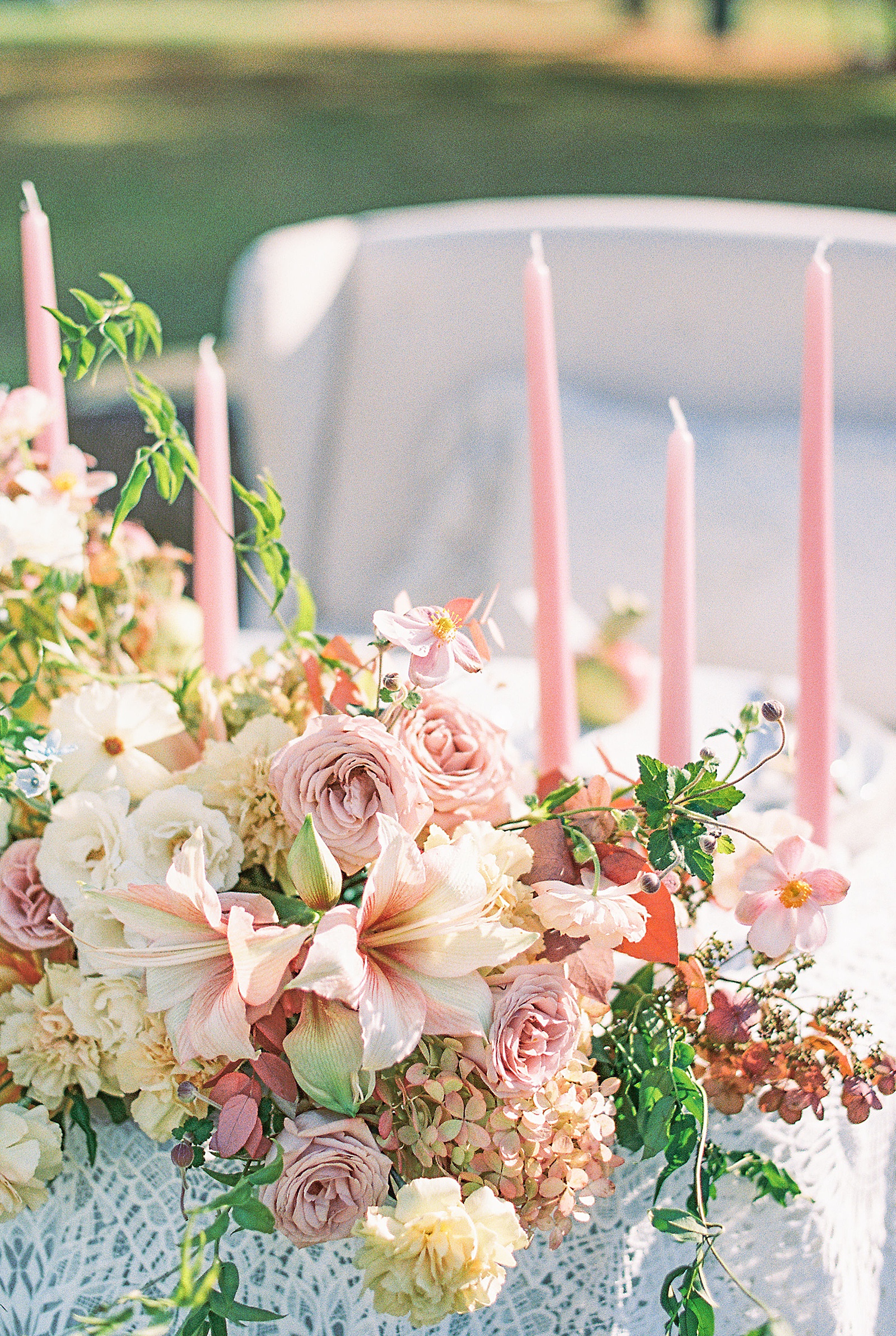 Pink blush florals by photographer talking about wedding expo essentials for best ROI