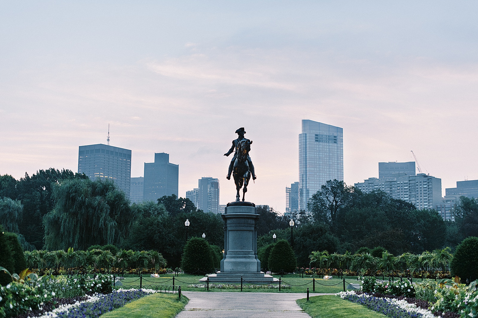 statue at sunset for public garden engagement session