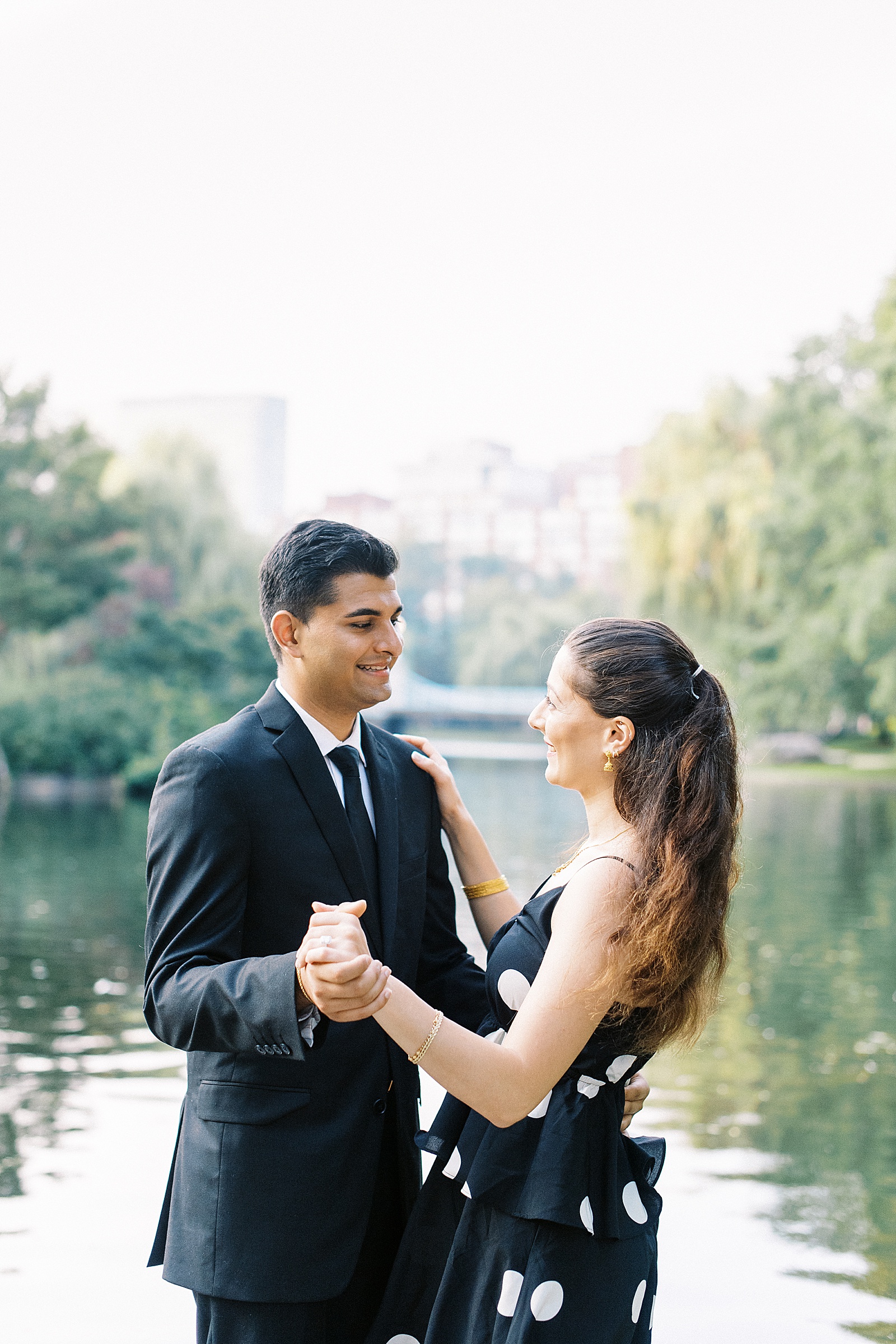 Engaged couple dancing next to pond in Massachusetts by Lynne Reznick photography 