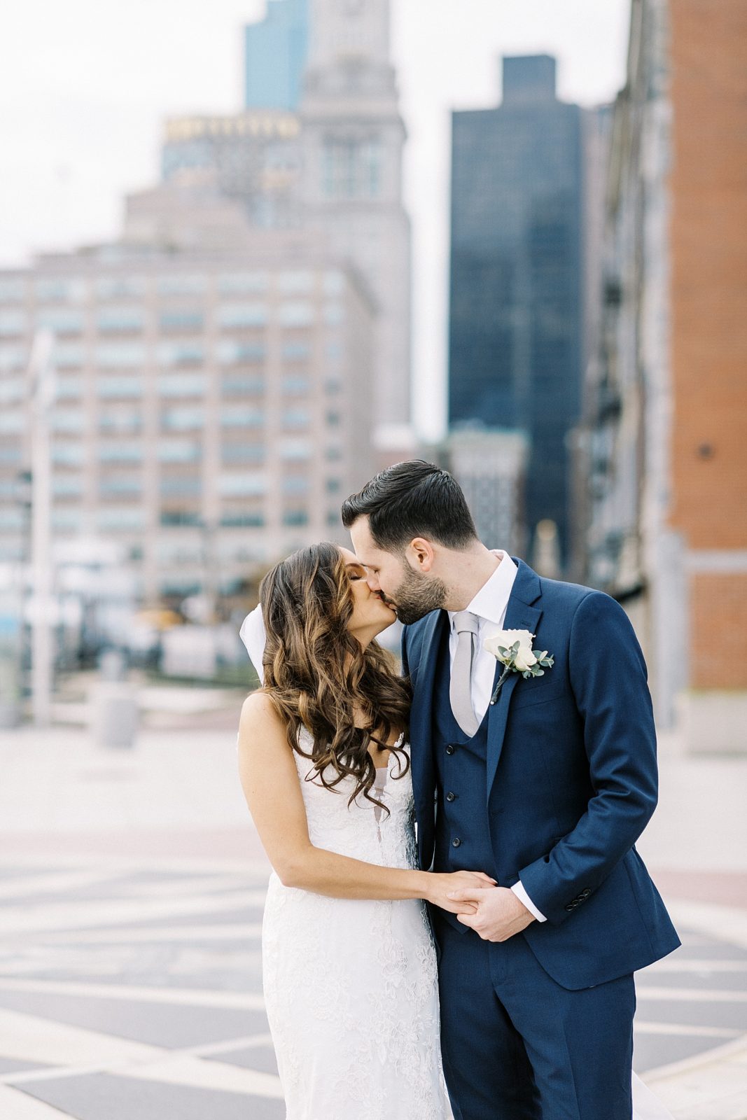 Newlyweds kissing in downtown Boston by Lynne Reznick Photography