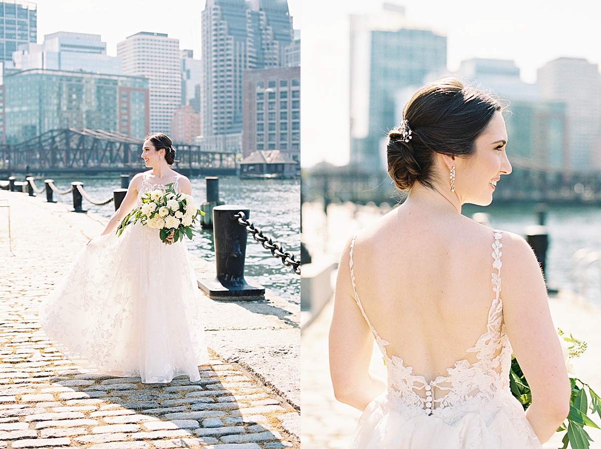 bride in romantic lace gown poses on waterfront for Massachusetts wedding photographer