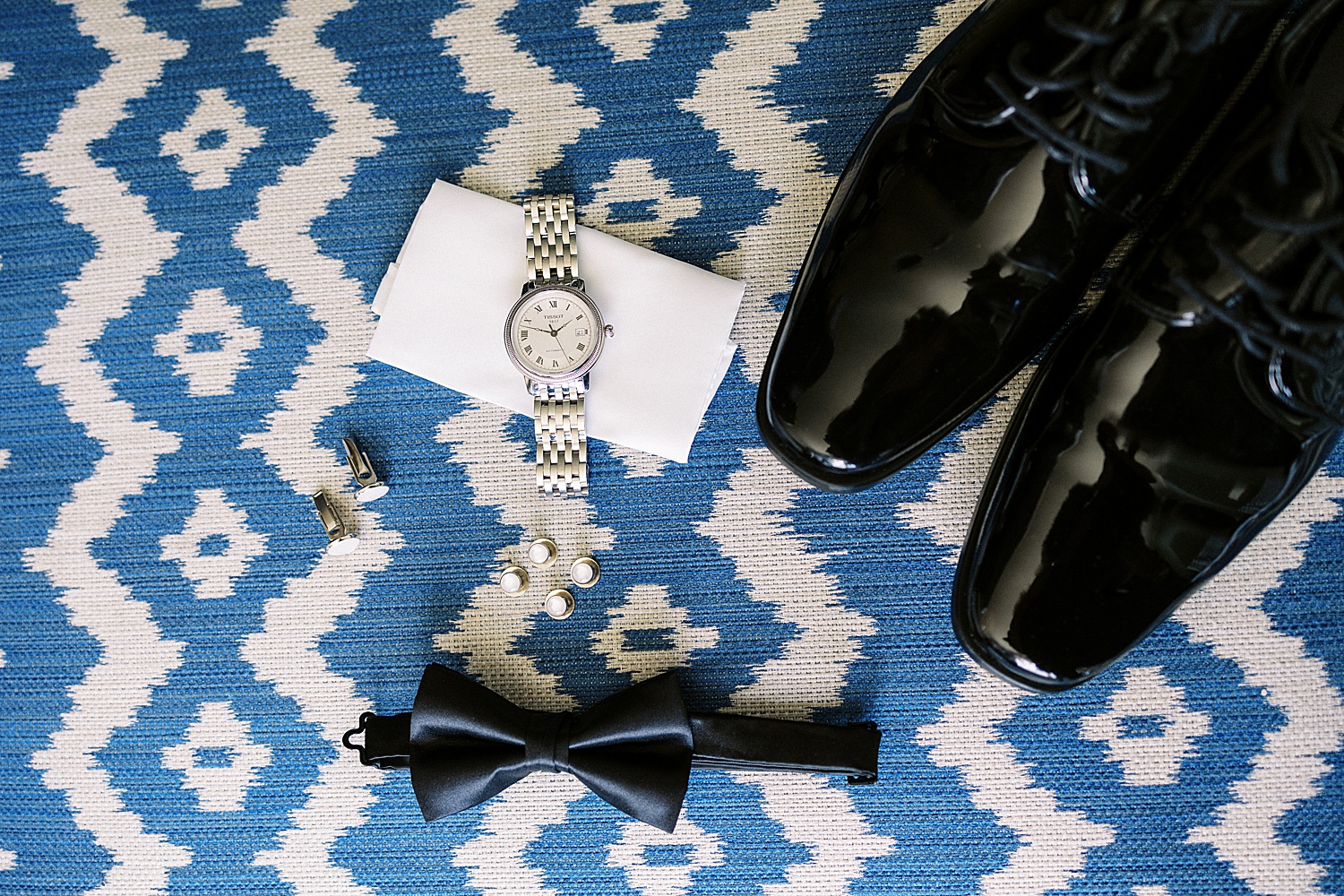 Grooms details like watch and bowtie by Lynne Reznick photography