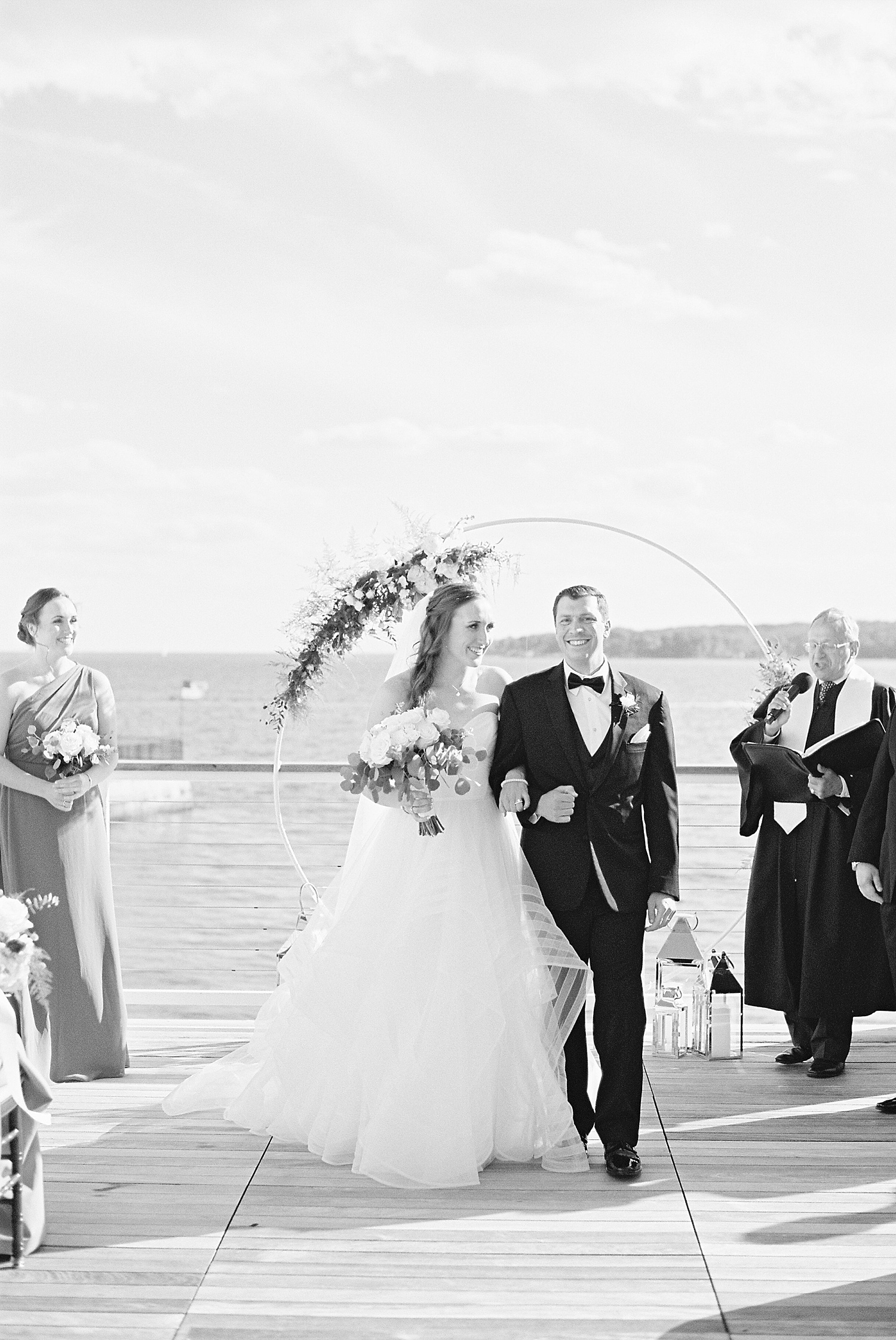 Bride and groom walking back down the aisle by Lynne Reznick photography