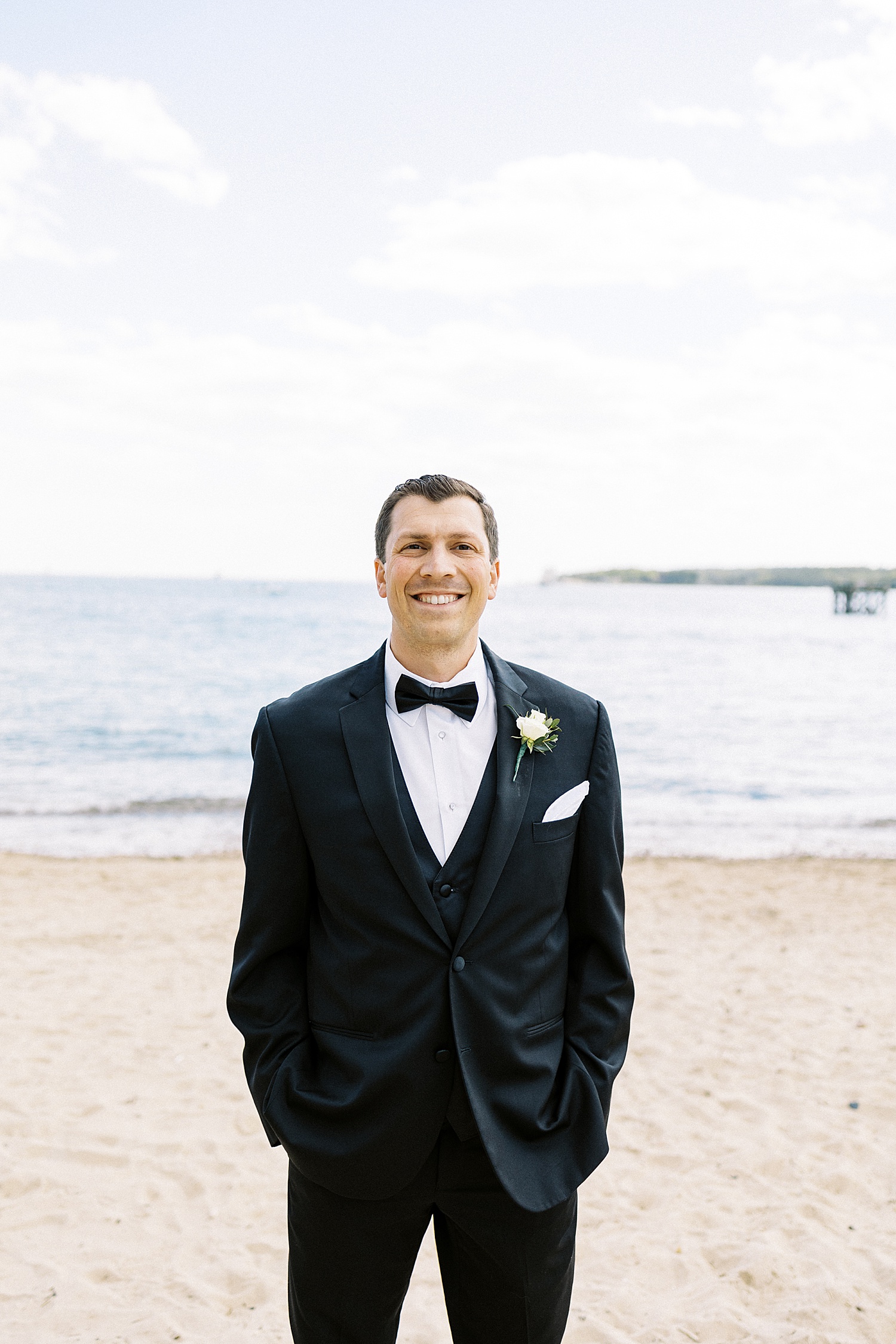 Groom at the waterfront by Beauport Hotel