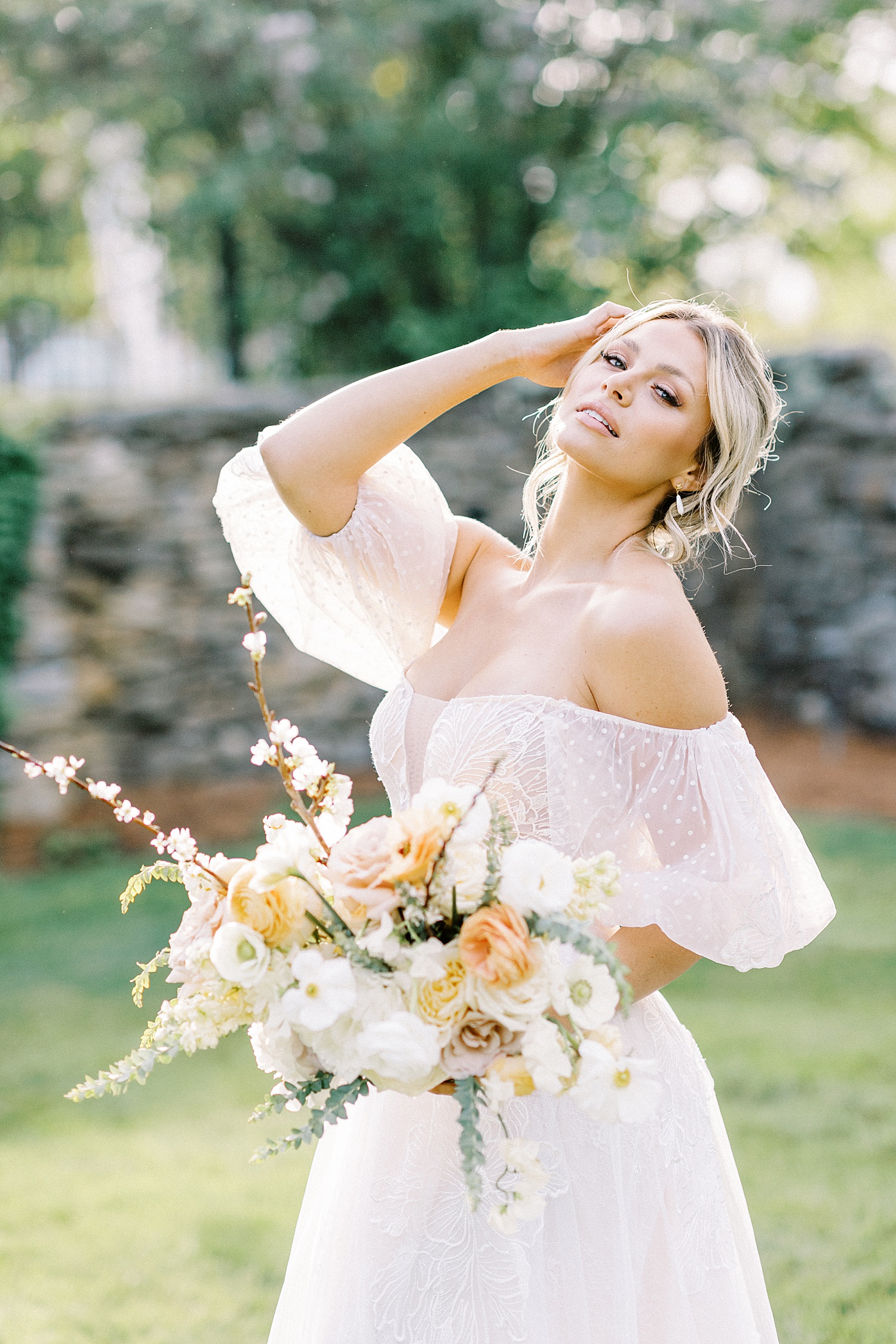 romantic bride with whimsical flowers by Lynne Reznick photography