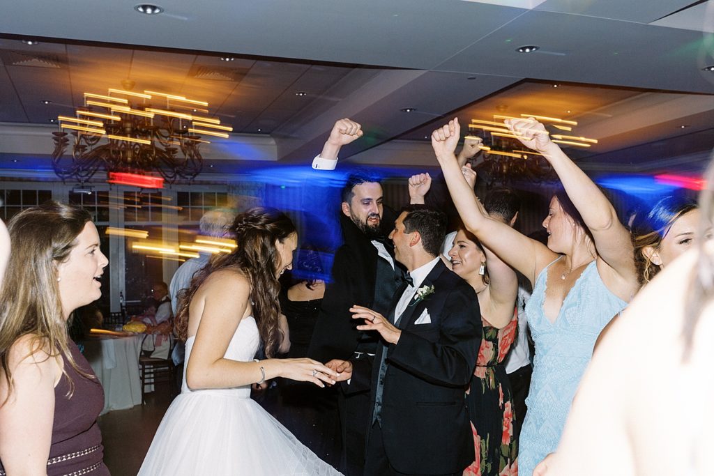 Bride and groom dancing with their guests at Beauport Hotel