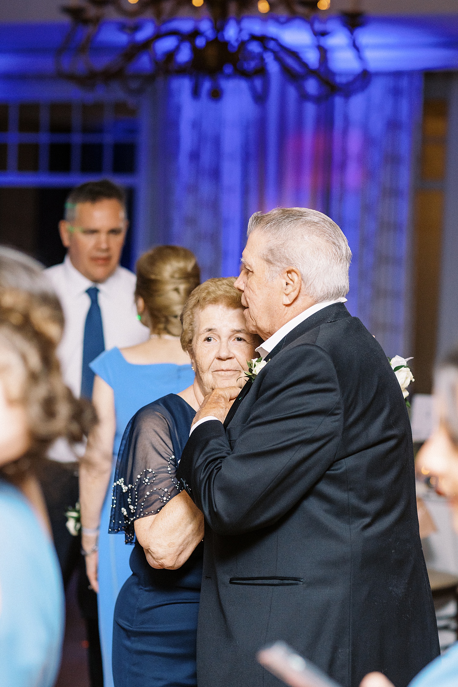 Grandparents dancing closely by Lynne Reznick photography