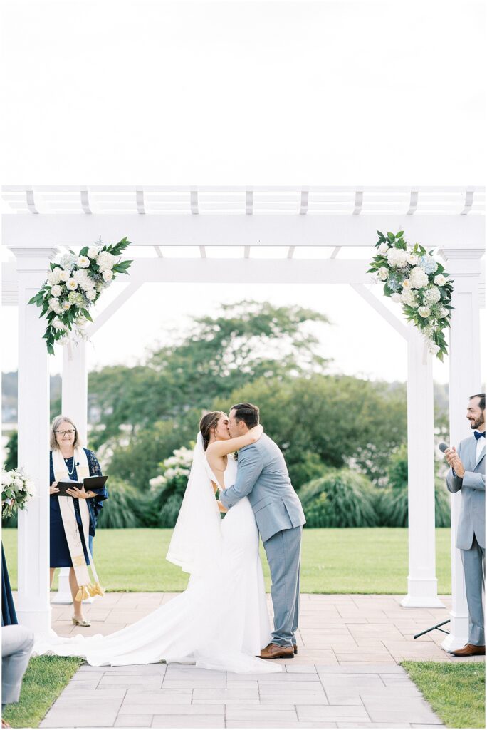 first kiss at Atlantic Resort Wyndham Newport wedding
