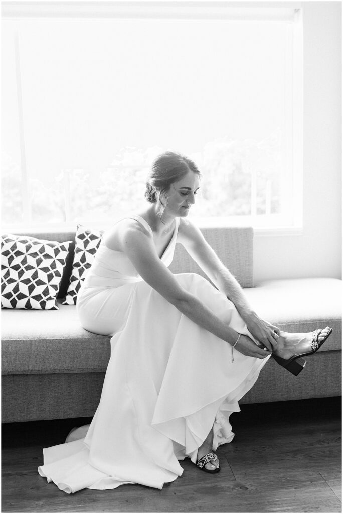 bride getting ready for her summer wedding in Newport in black and white