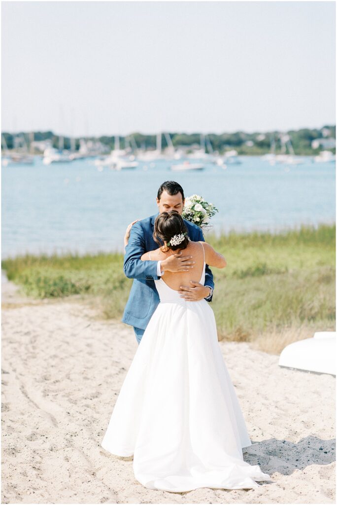 couple embraces on wedding day in Chatham MA