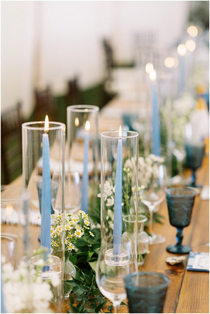 taper candles and flowers lining head table for cape cod wedding