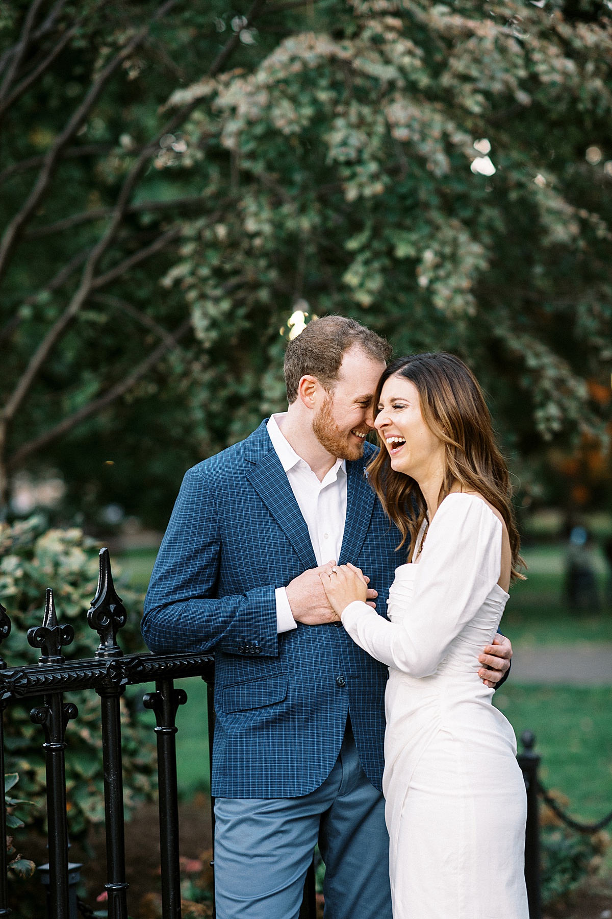 Man and women laughing together during their engagement photos with Lynne Reznick Photography