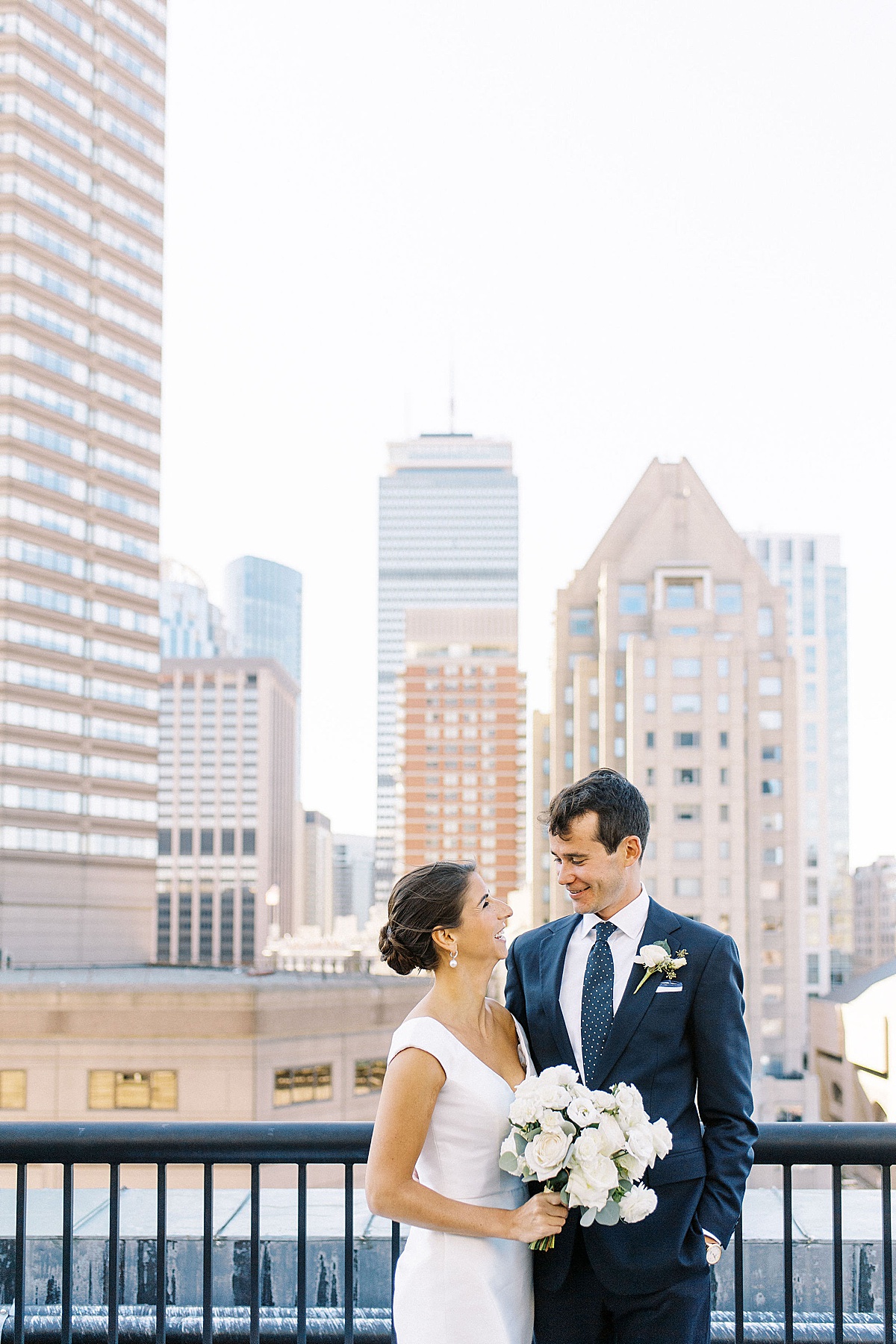 bride and groom on Fairmont Copley Plaza roof top captured  by Boston Wedding photographer