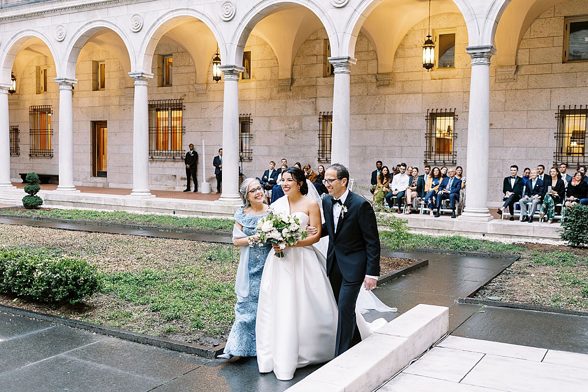 brides mom and dad walking her down the aisle for her Public Library Wedding 