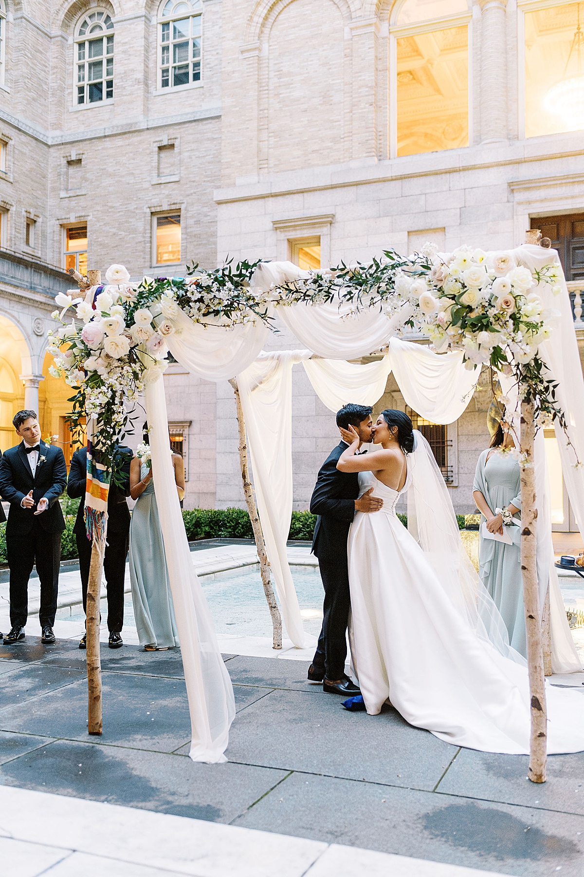 bride and groom kissing for first time captured by Boston Wedding Photographer 