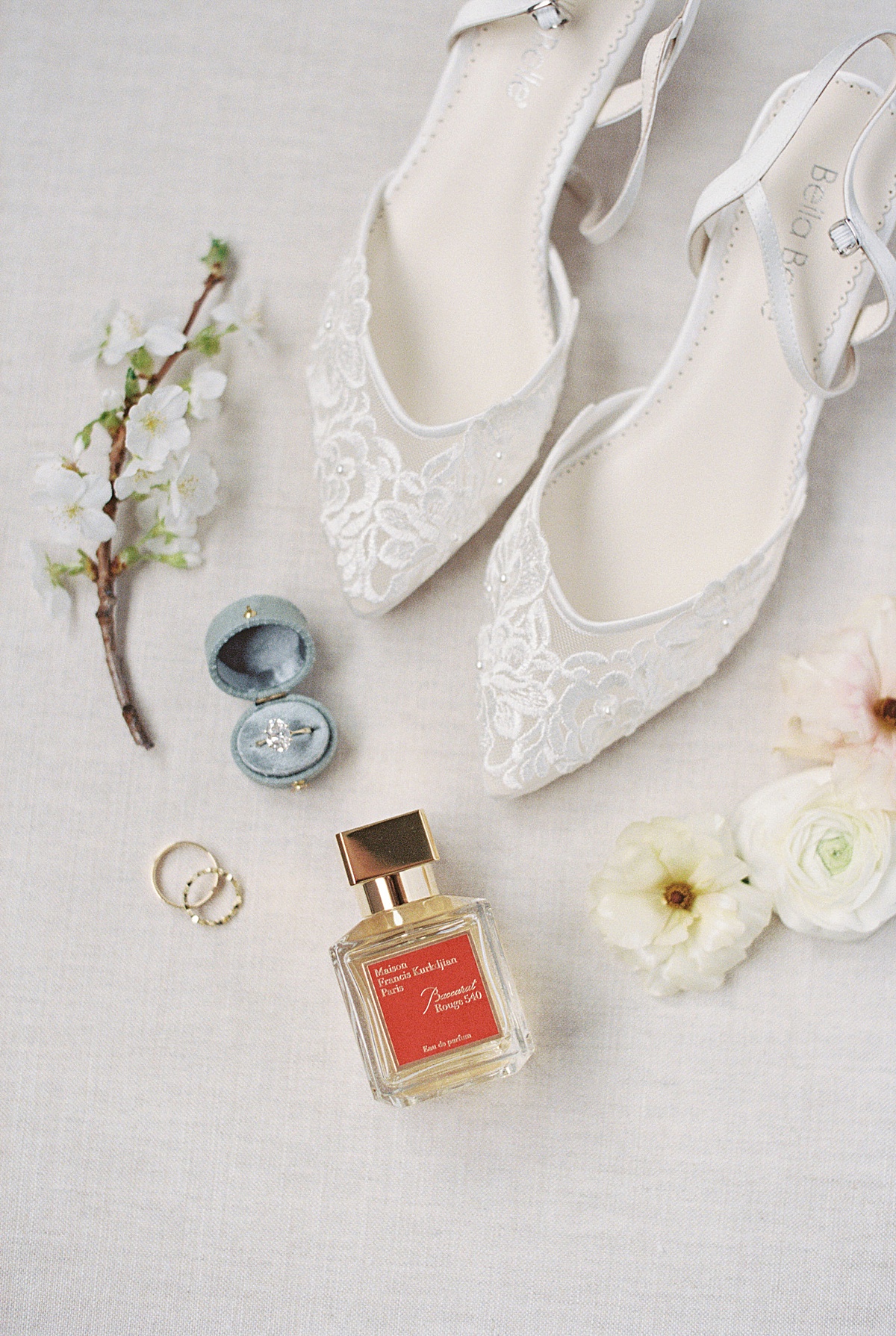 bride wedding shoes and perfume, captured by Lynne Reznick Photography