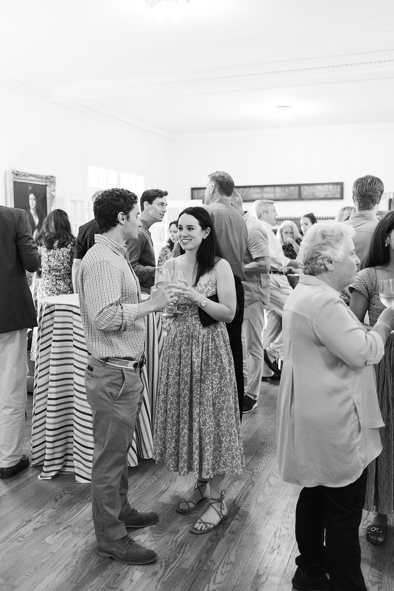 guests mingle during rehearsal dinner by Catskills NY wedding photographer