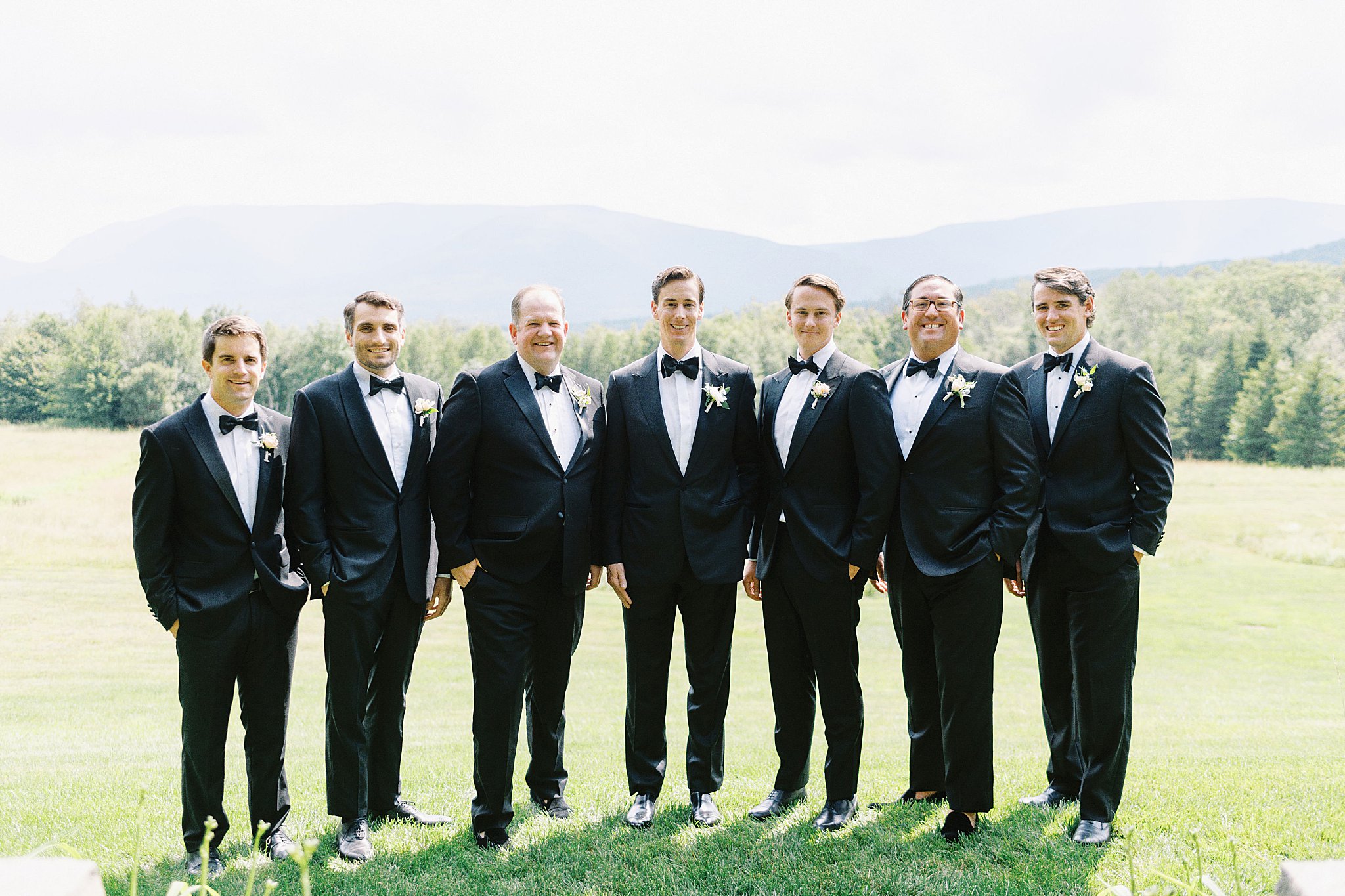 groomsmen stand together on lawn at Onteora Club