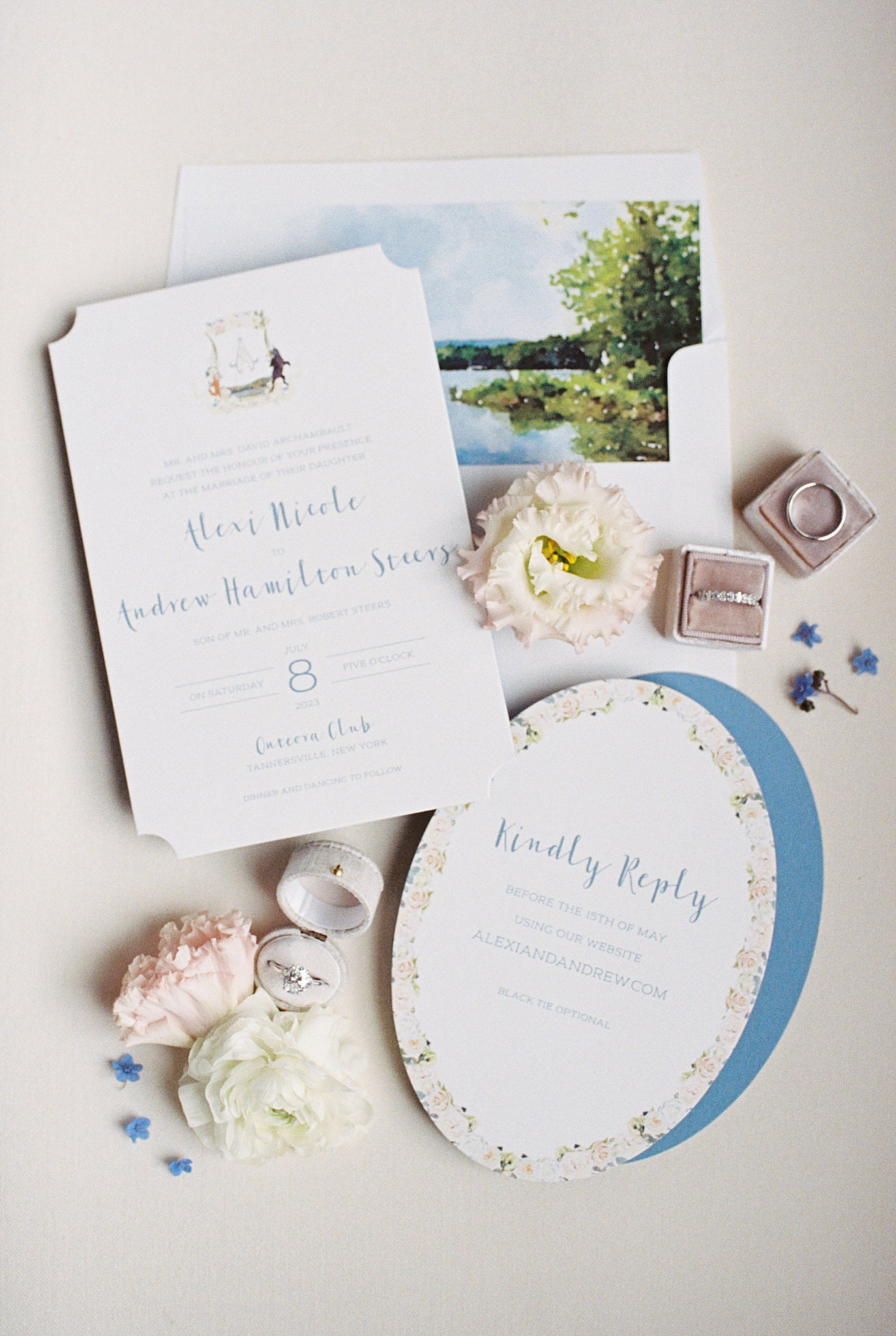 invitation suite lay out surrounded by flowers by Catskills wedding photographer