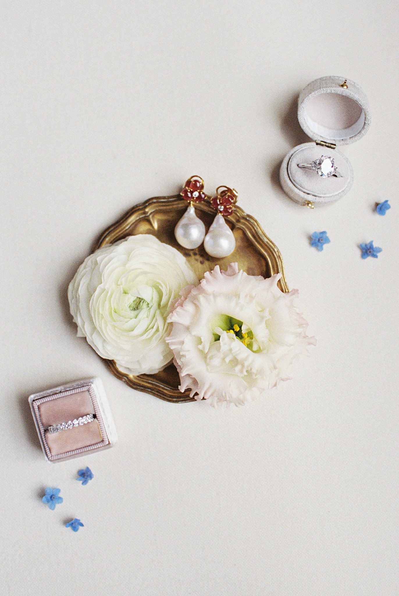 bridal details and invitation flatlay on table by Lynne Reznick Photography 