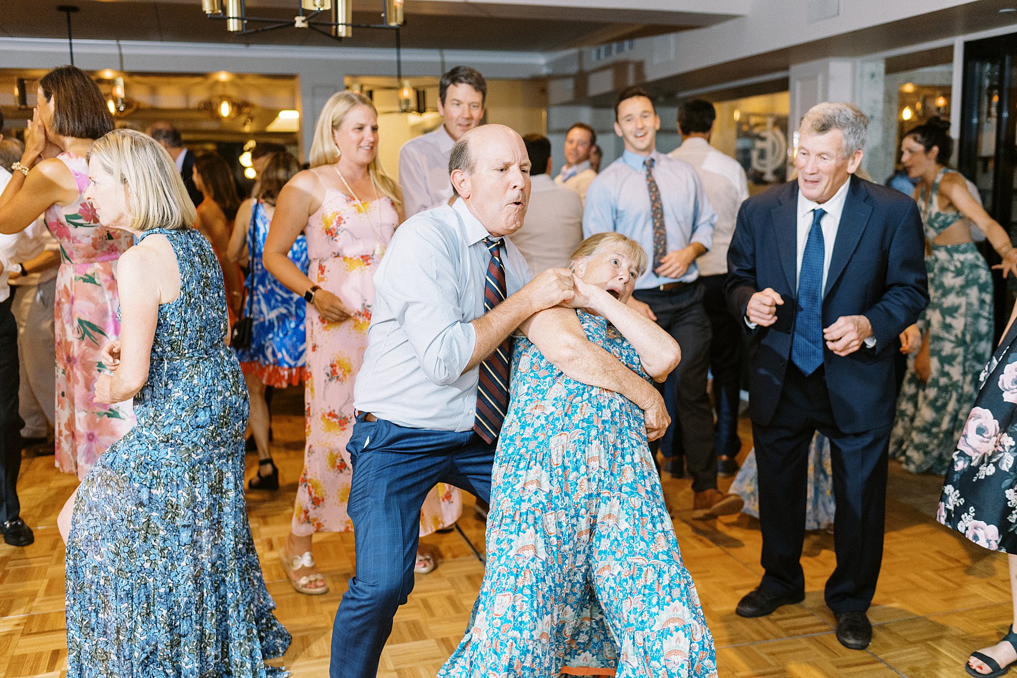 guests dance during reception at Field Club of Greenwich 
