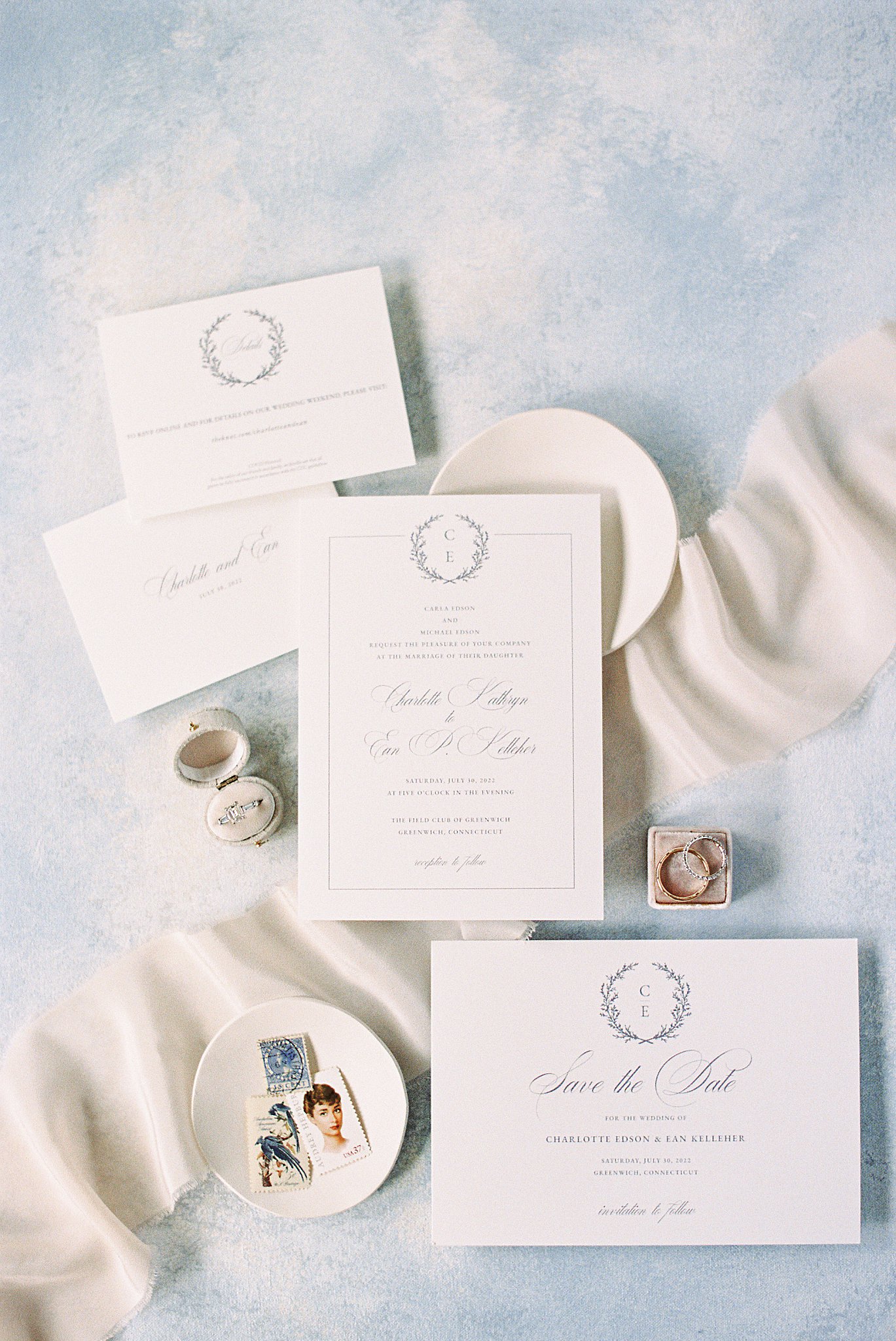 invitation suite laid out with rings by Cape Cod wedding photographer