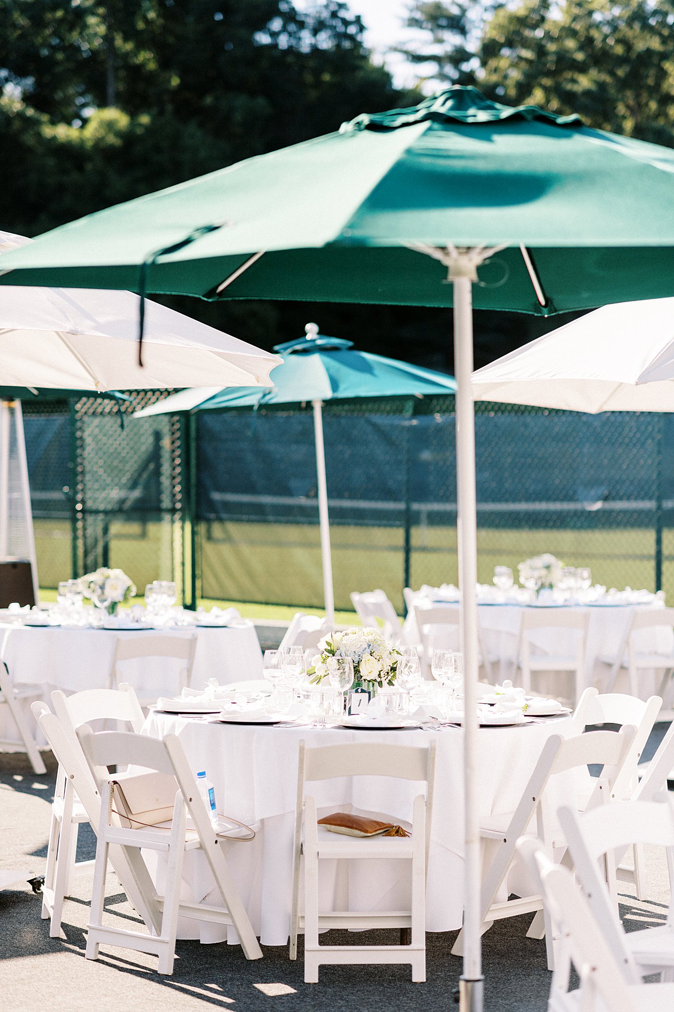 tables set on the courts for reception at Field Club of Greenwich 