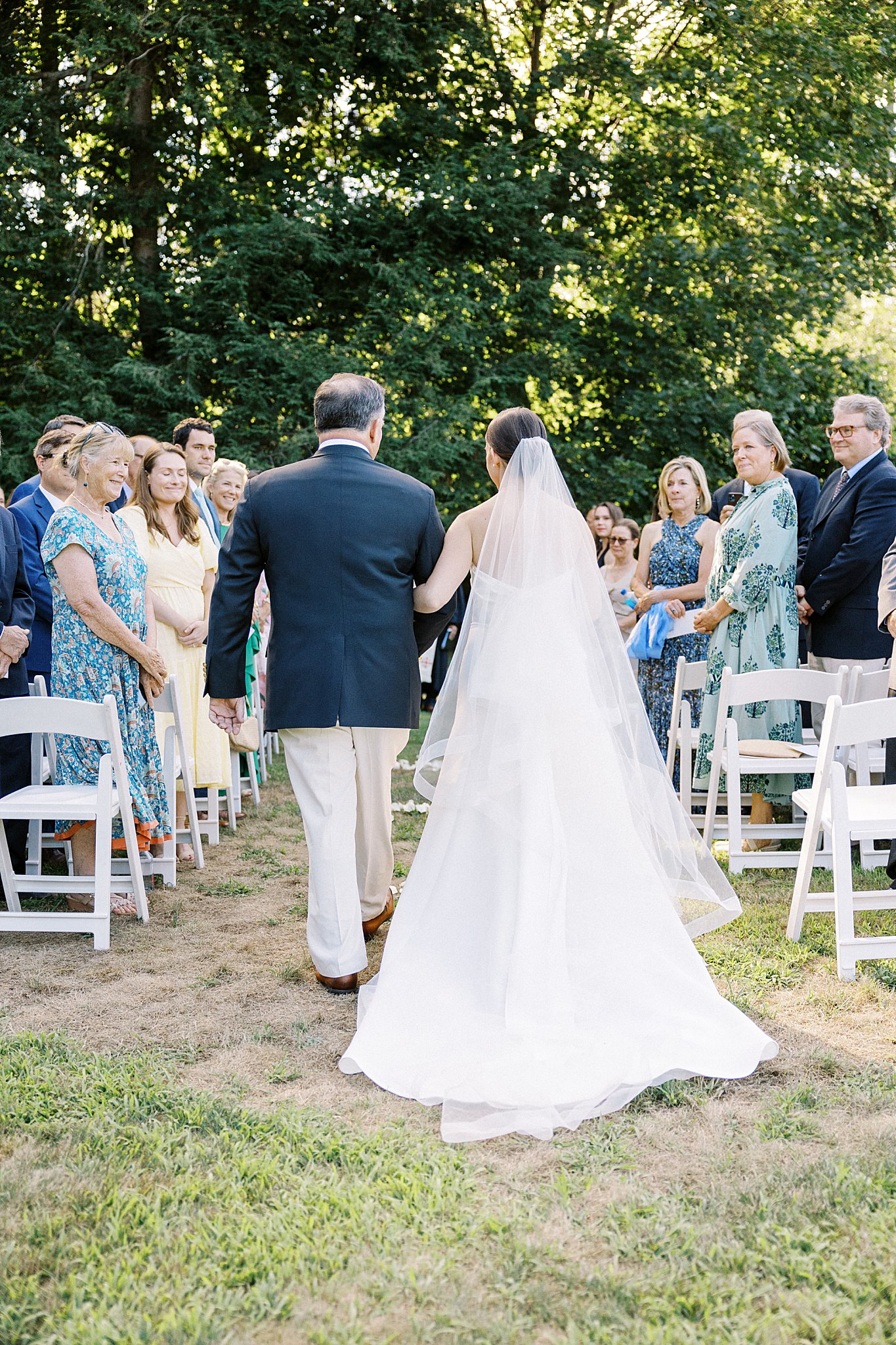 father of the bride walks his daughter down the aisle by Lynne Reznick Photography 