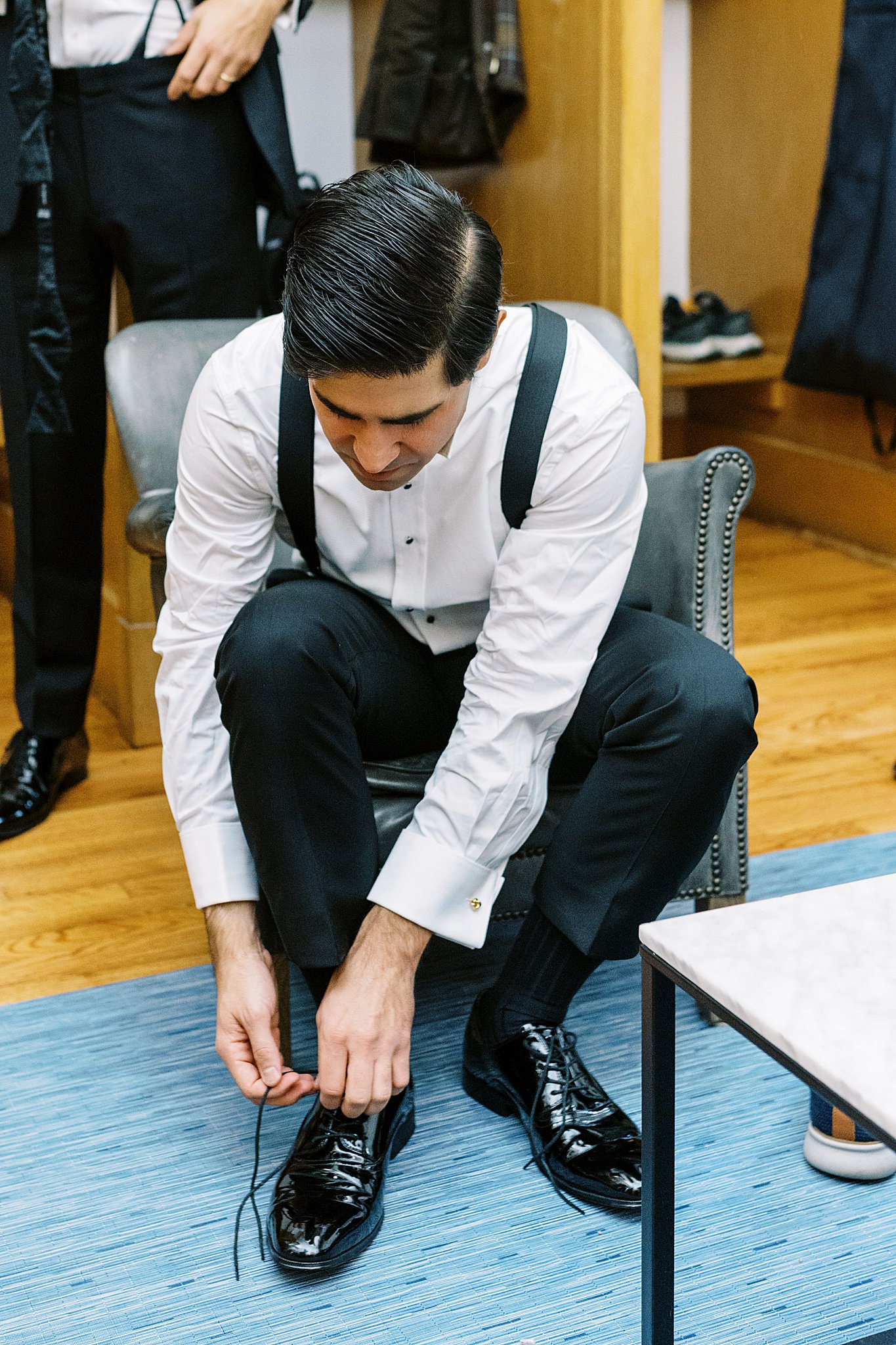 groom ties shoes at Brooklyn Heights Casino