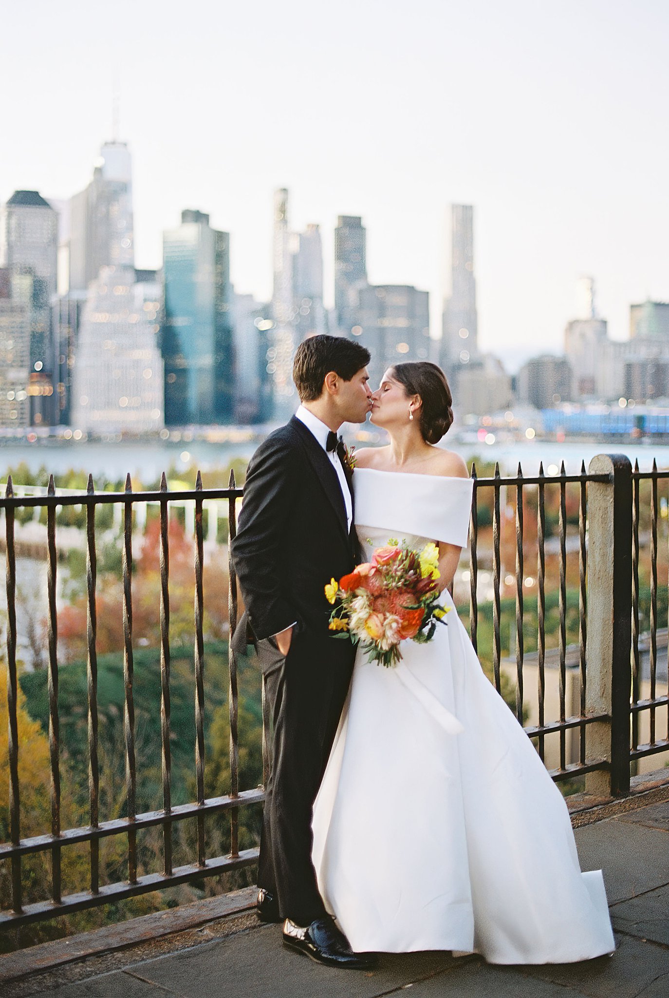 couple kisses during golden hour at Brooklyn Heights Casino