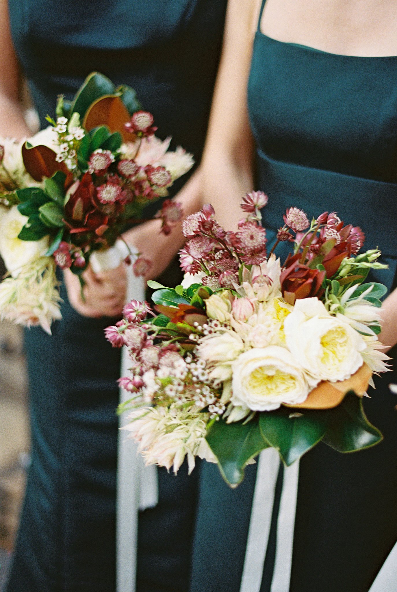 floral bouquets held by bridesmaids by NYC wedding photographer 