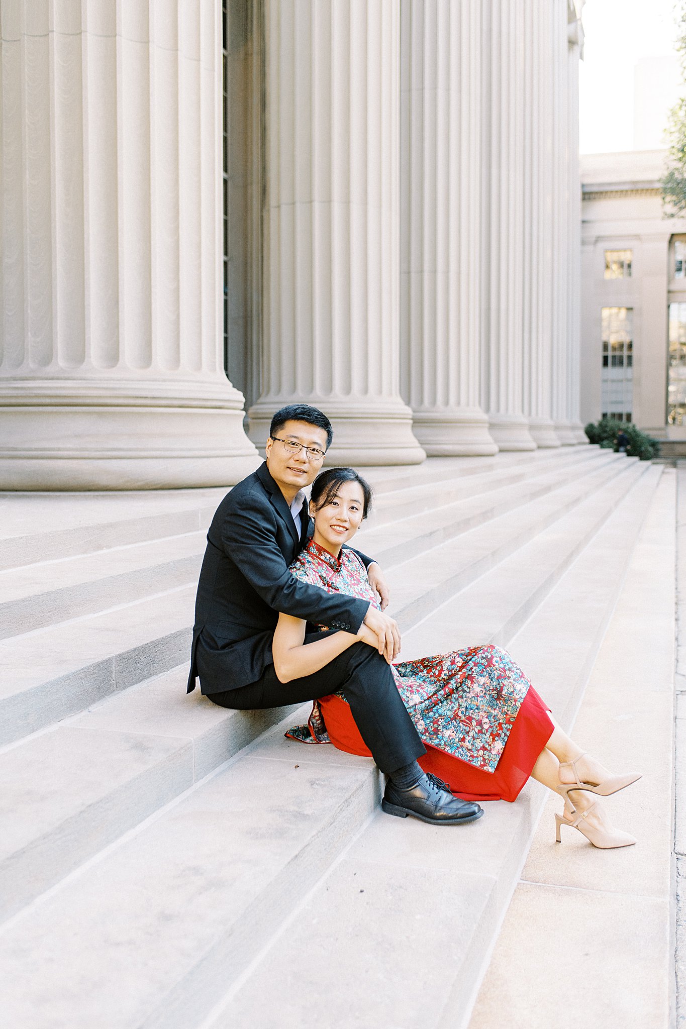 couple sits on steps at MIT in Cambridge together during Public Garden Anniversary session