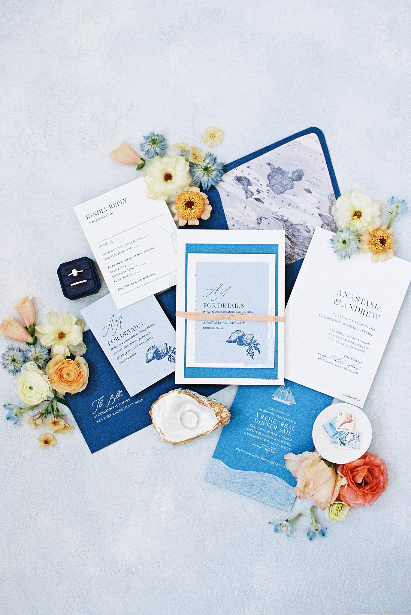 nautical stationery is accented by blooms and trinkets by Boston wedding photographer