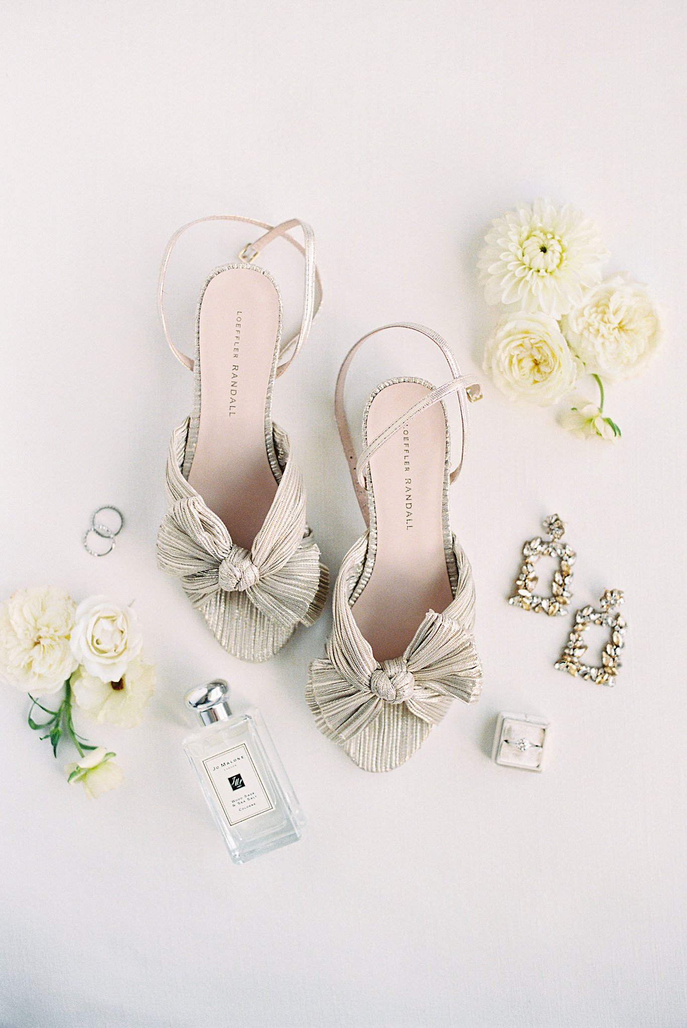 bridal details including heels, earrings, and jewelry are displayed by Boston wedding photographer