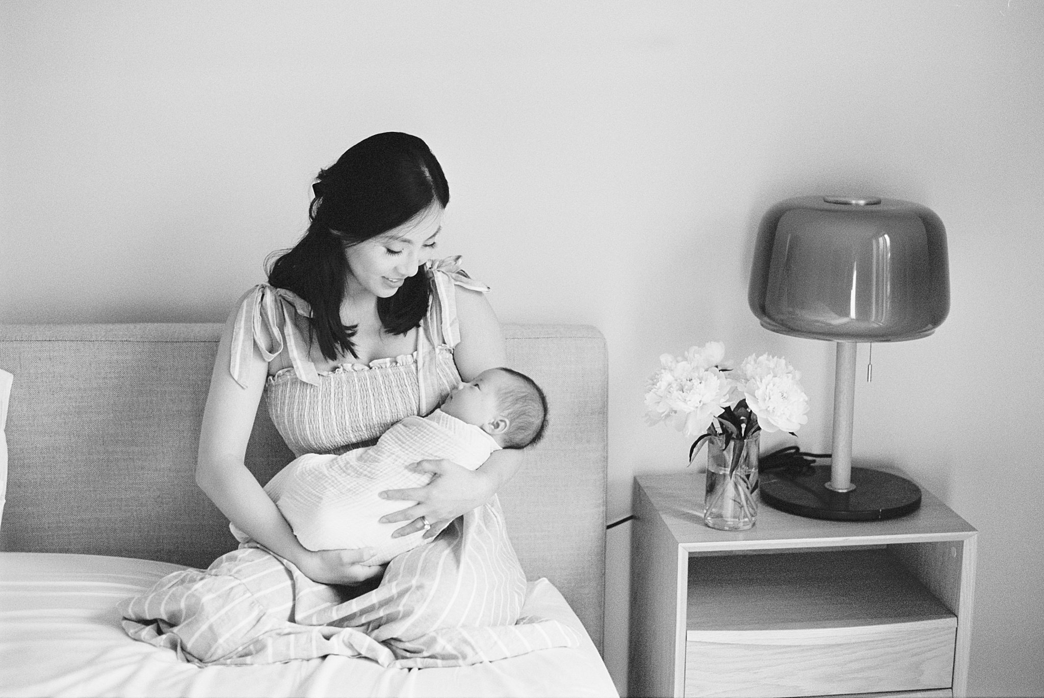 mother holds son during in-home lifestyle session