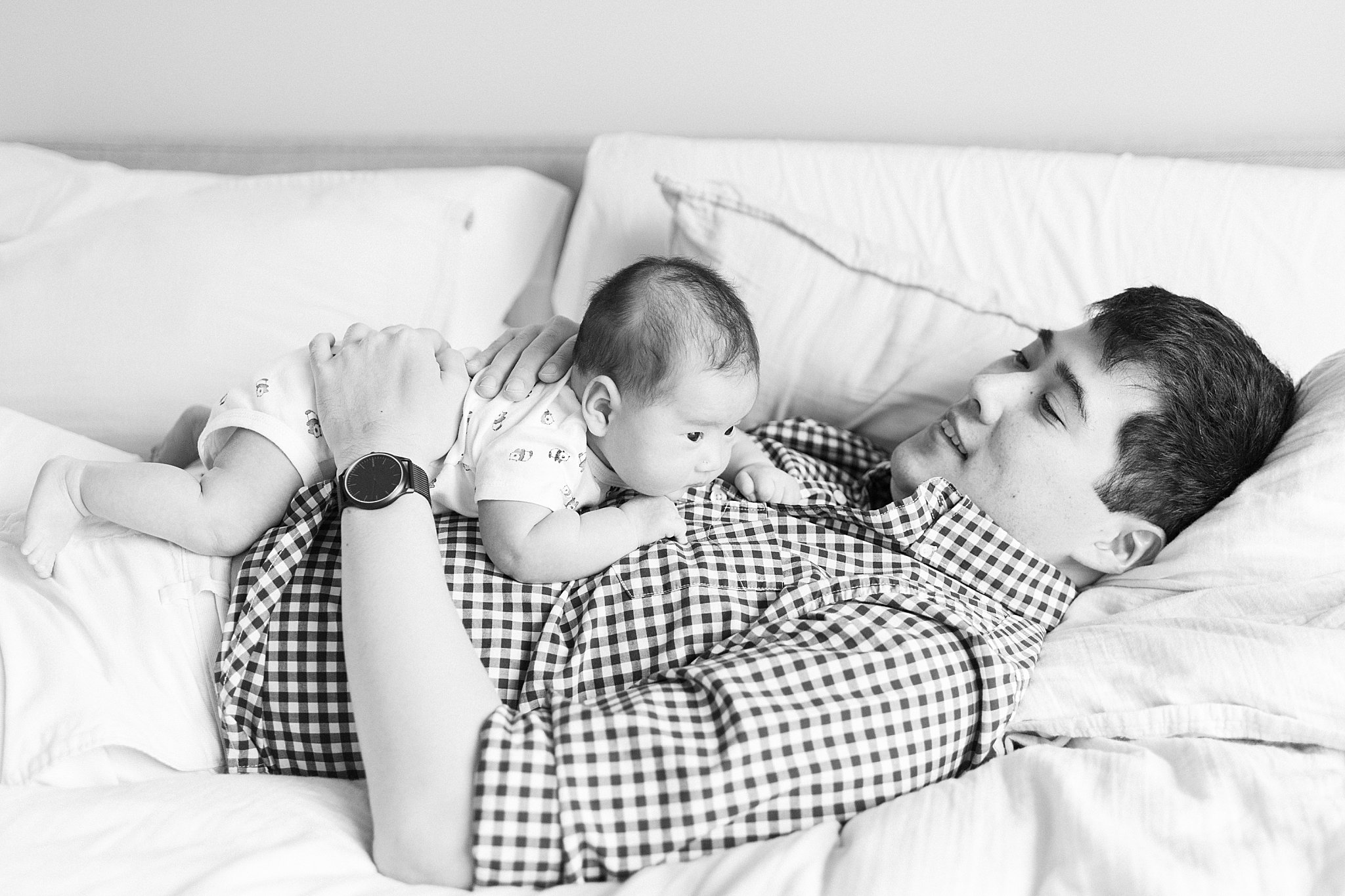 baby lays on dad's chest by Boston family portrait photographer