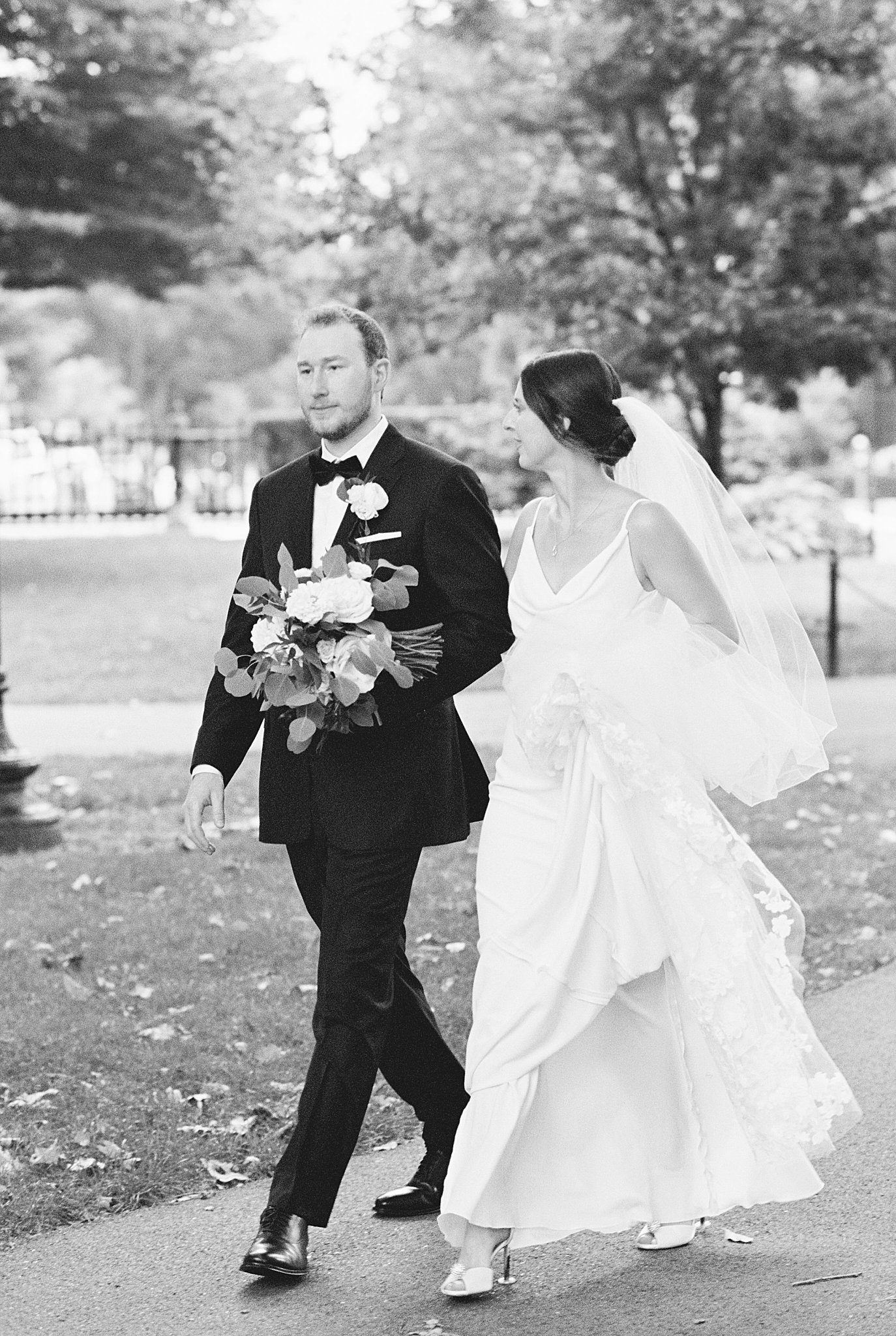 bride and groom walk together to Museum of Science ceremony