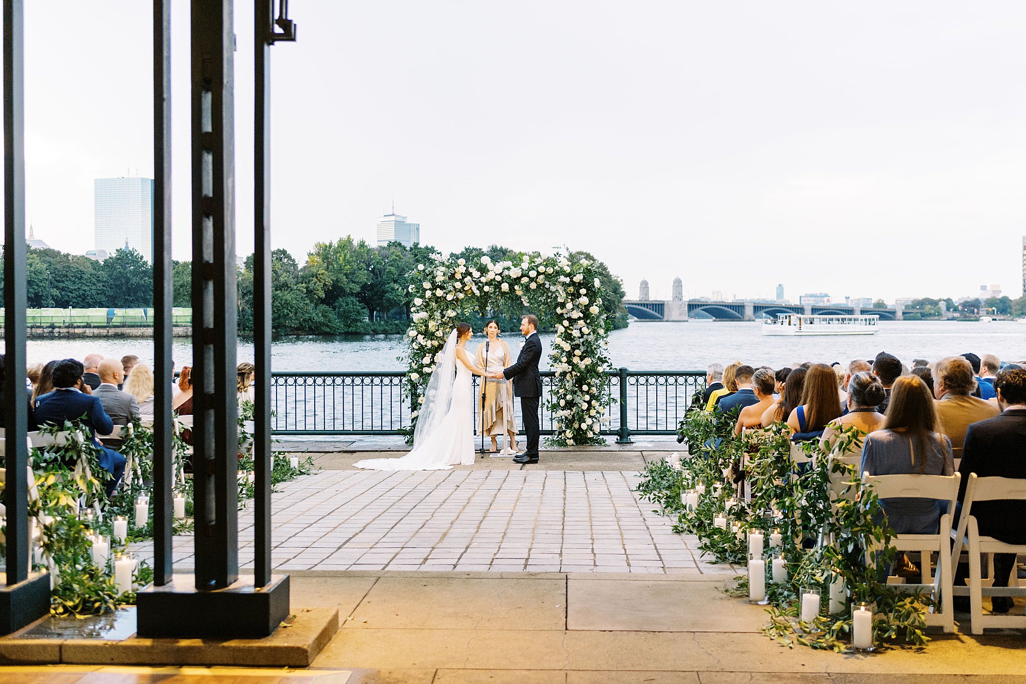 couple holds hands at altar by Lynne Reznick Photography