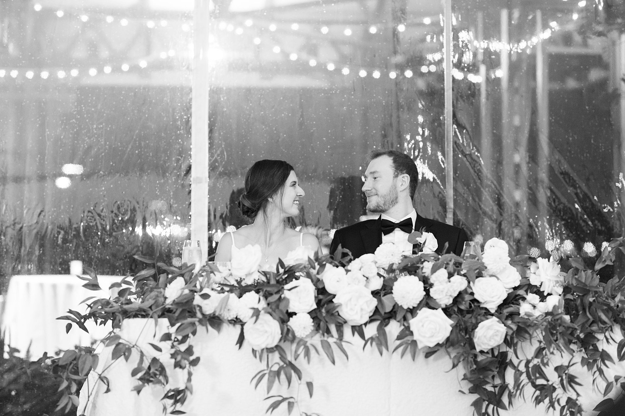 bride and groom smile at each other during reception at Museum of Science 