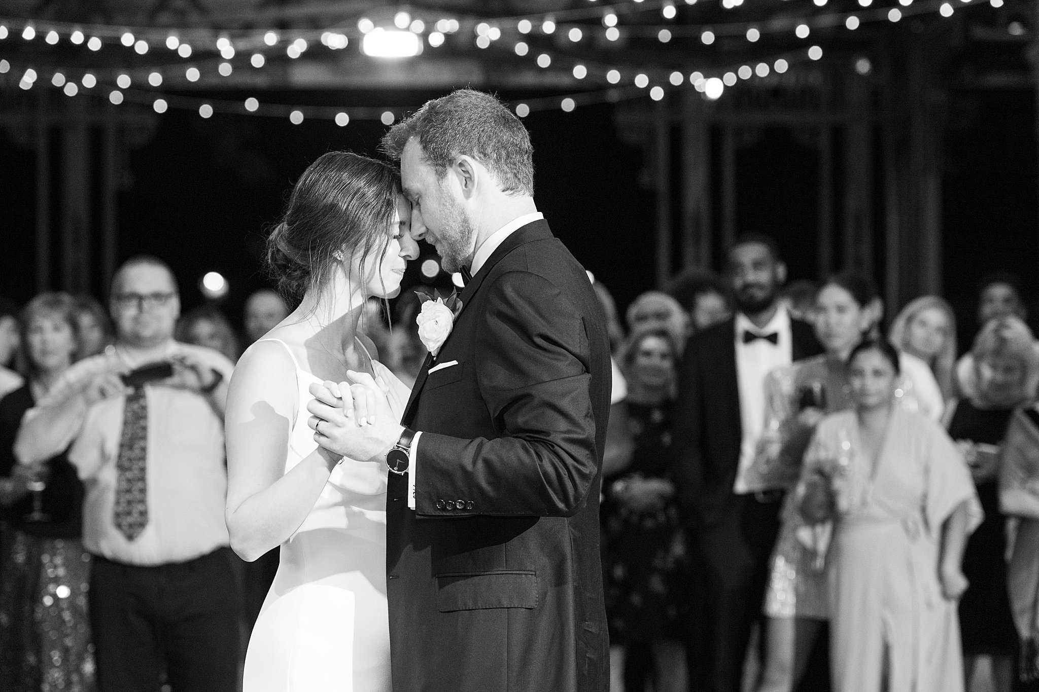 couple touches foreheads as they share first dance by Lynne Reznick Photography