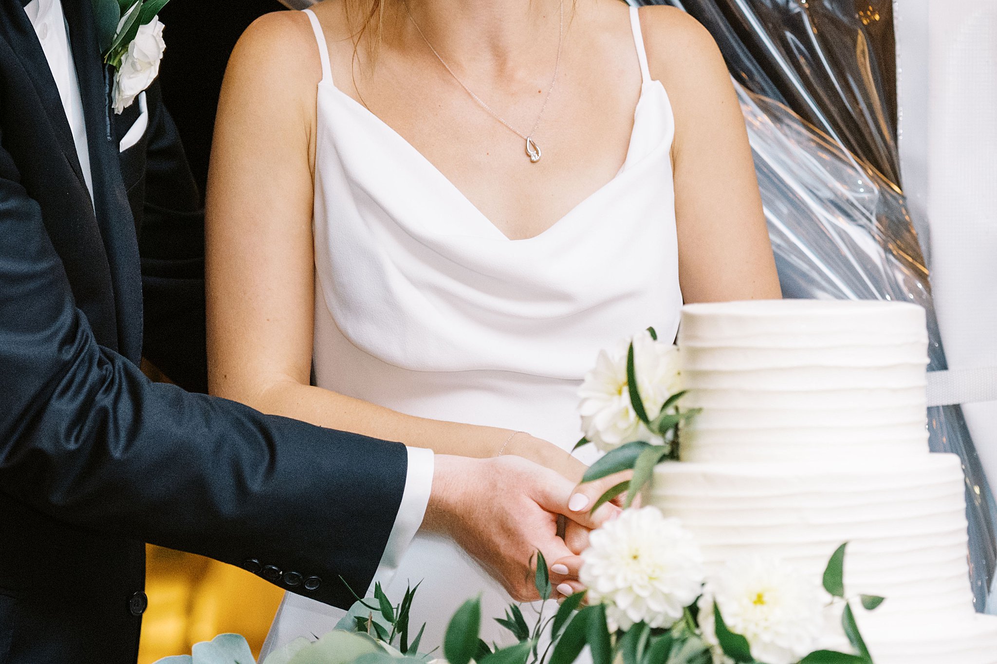 couple cuts their cake at the reception by Boston Wedding Photographer