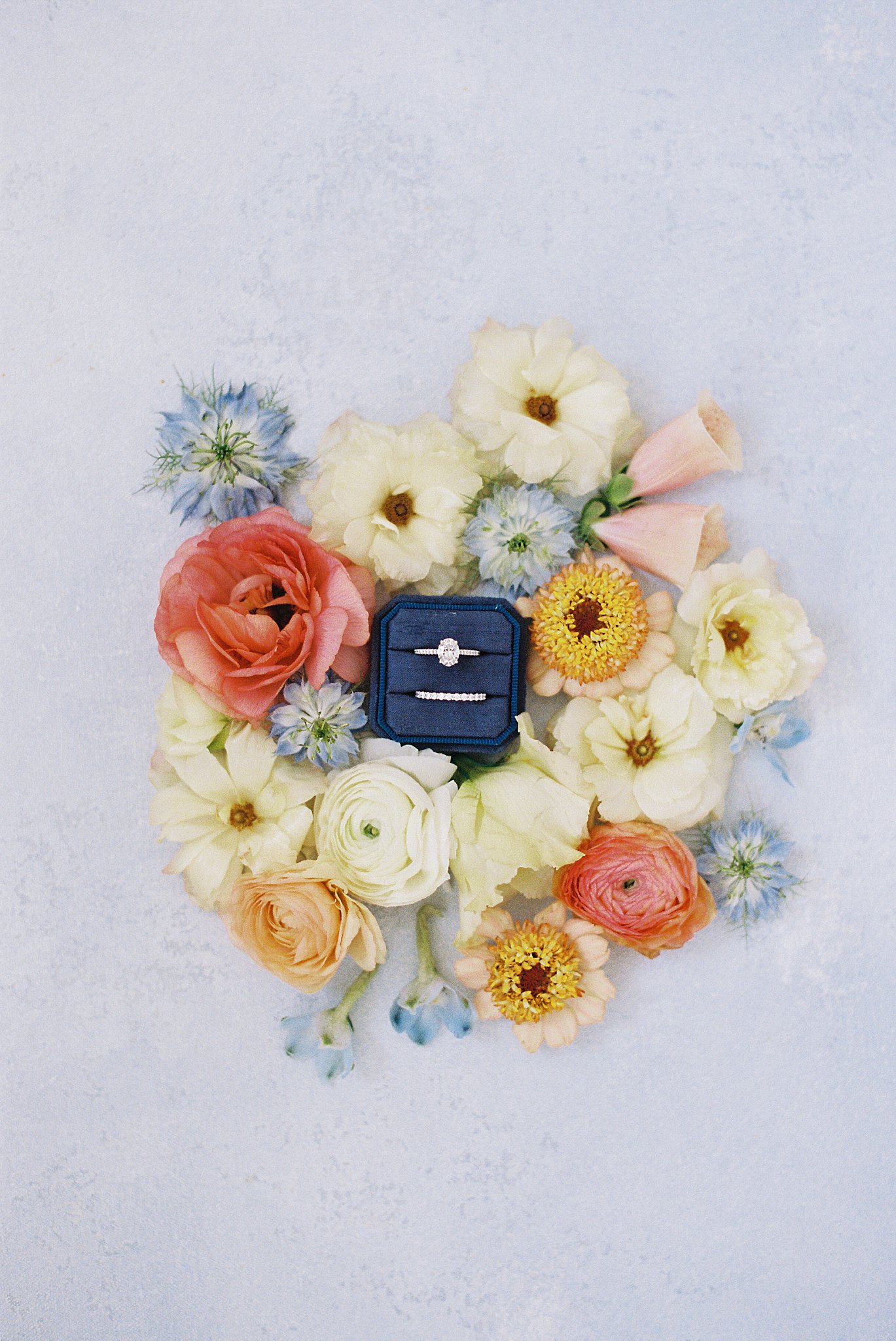 wedding ring set surrounded by florals by Boston wedding photographer